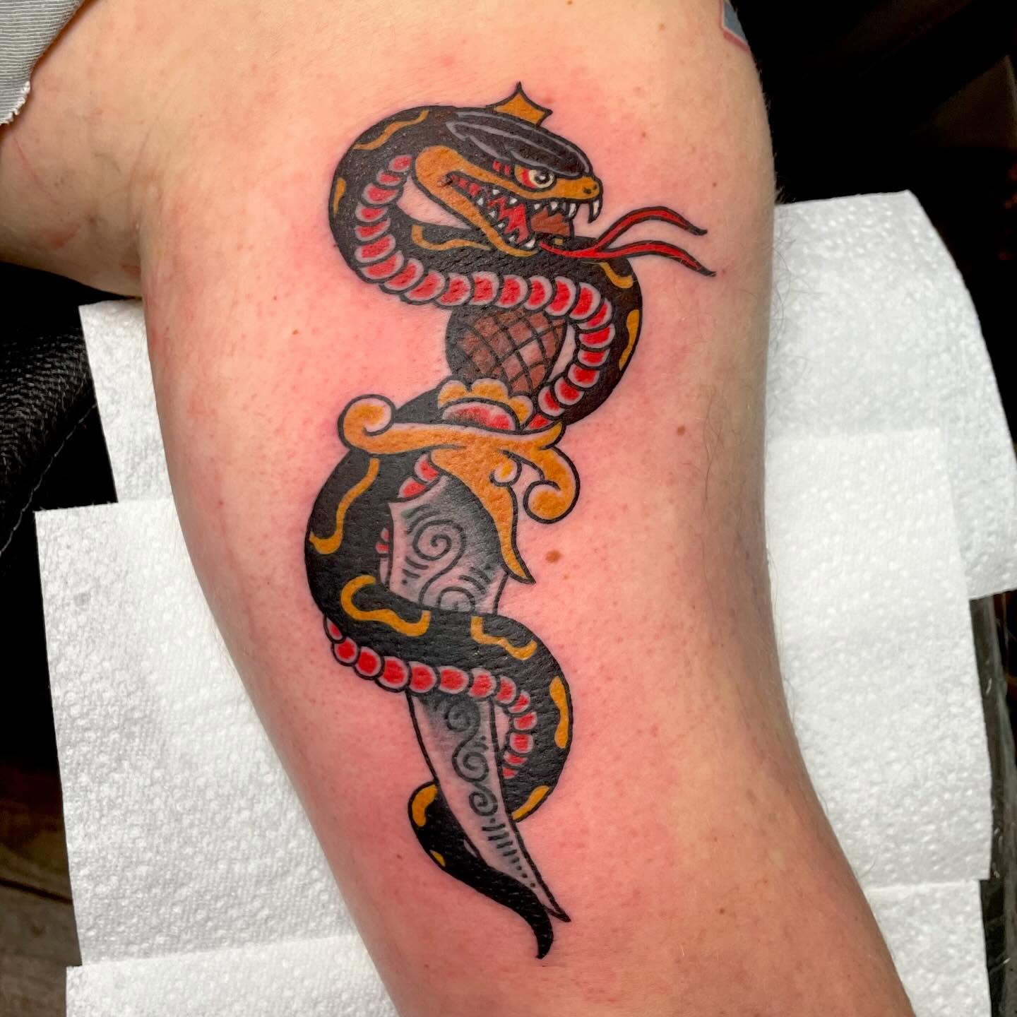 Snake American traditional tattoo on the forearm by Jessi Kilpatrick