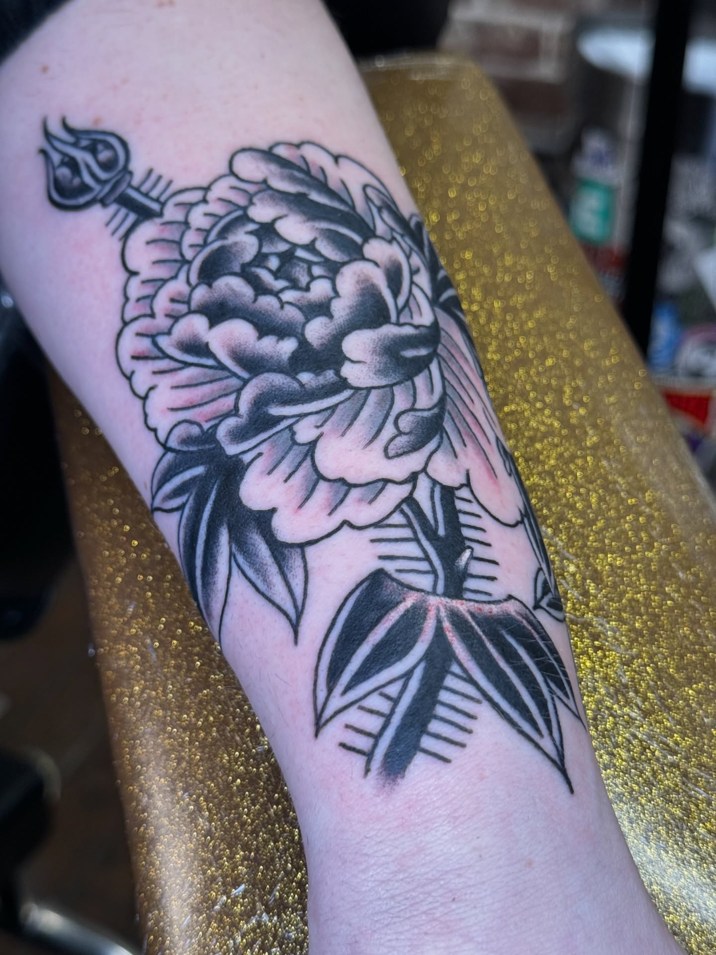 Peony flower black and grey tattoo on the forearm by Marc Brotemarkle