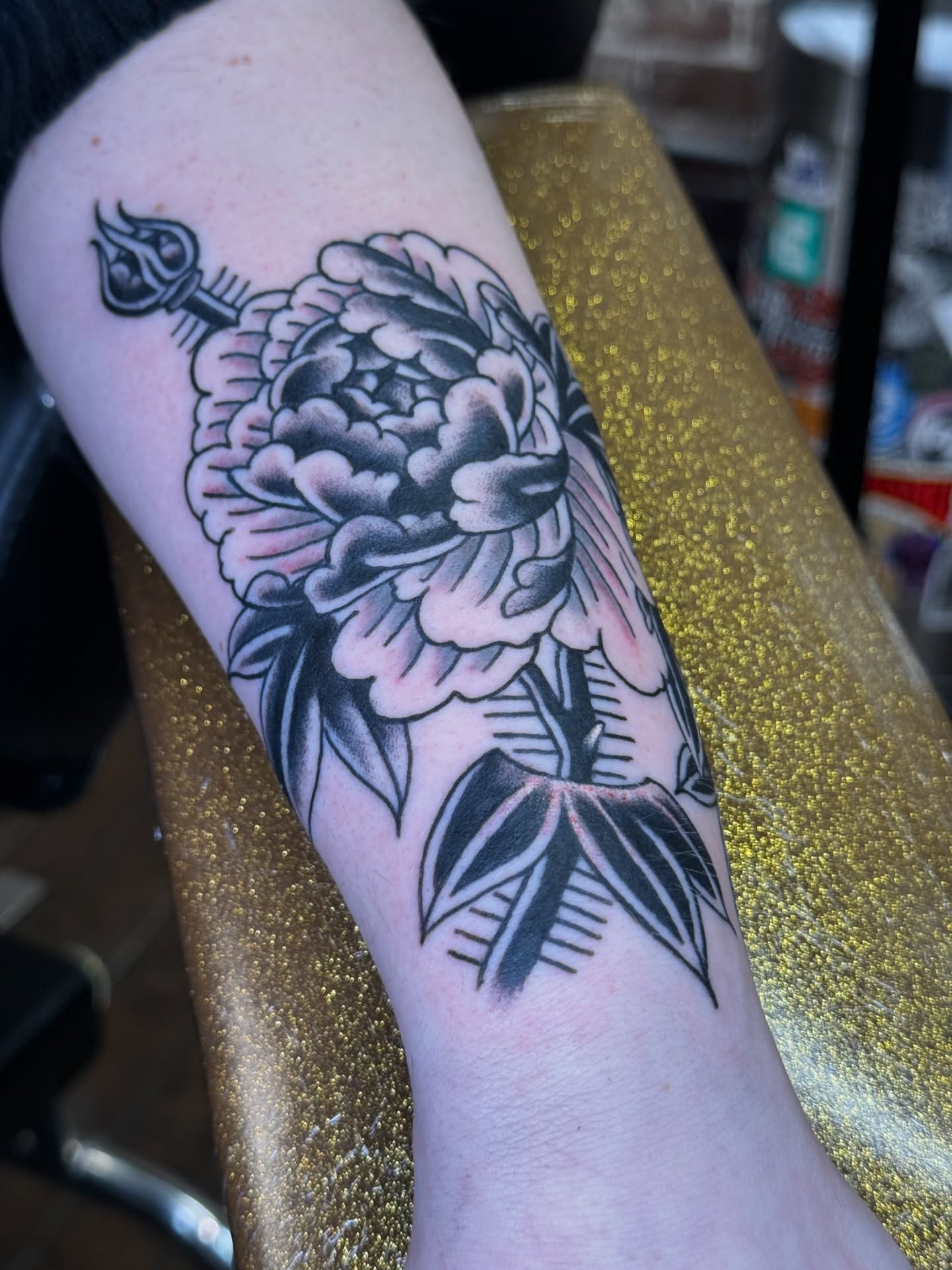 Peony flower American traditional tattoo on the forearm by Marc Brotemarkle