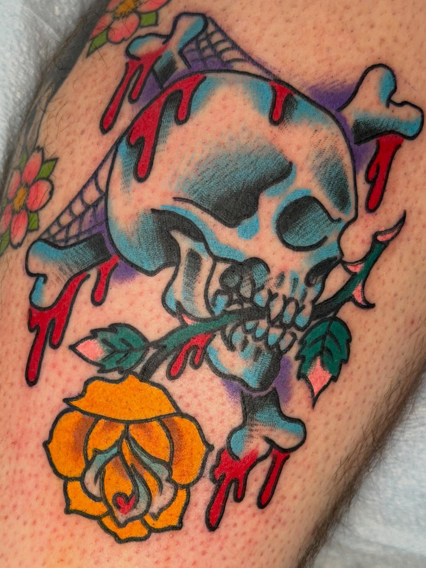 Skull and roses American traditional tattoo on the thigh by David Steed, Dallas, Texas