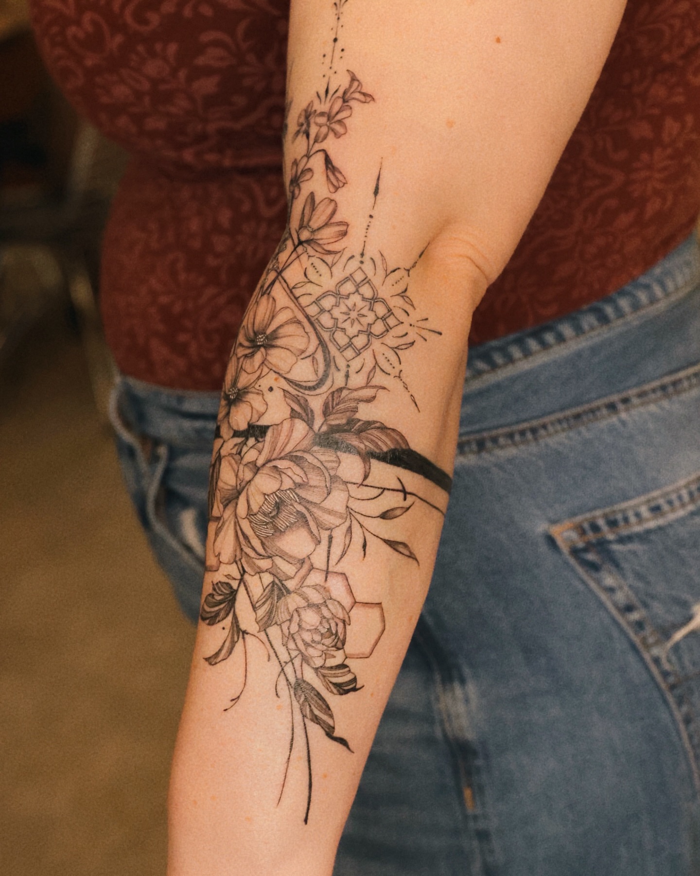 Floral bouquet black and grey tattoo on the forearm by MJ