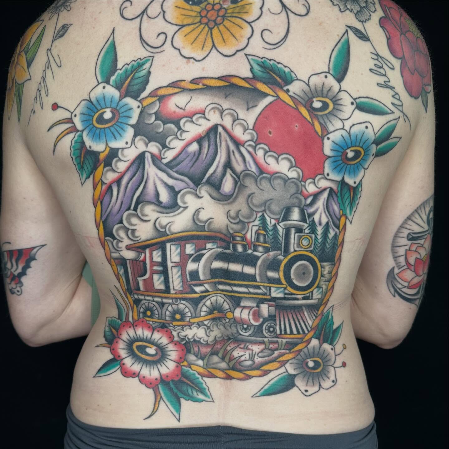 Steam train American traditional tattoo on the back by Austin Murfitt