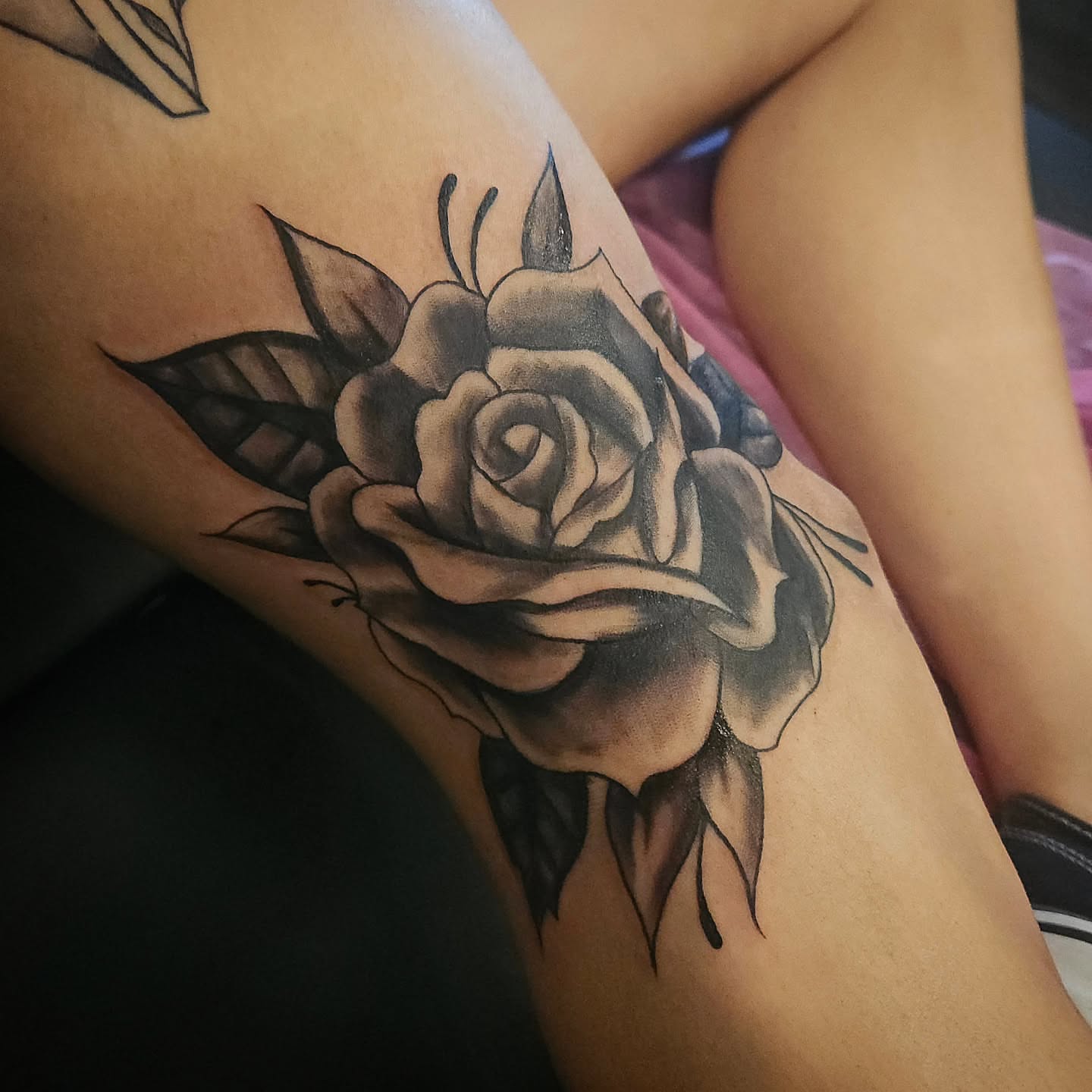 Rose black and grey tattoo on the thigh by Angie Griffith 🥰, Glendale, Arizona
