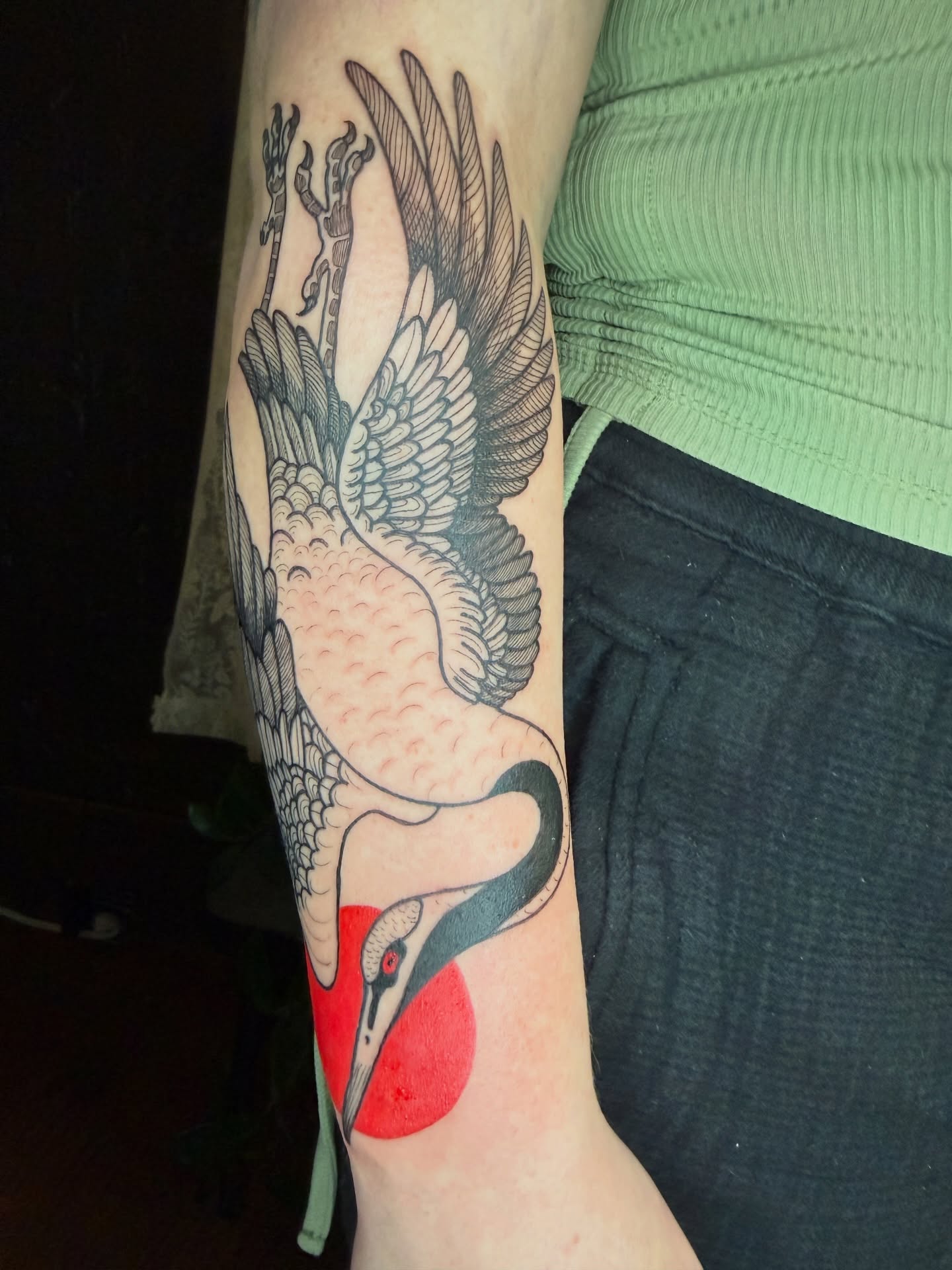 Bird black and grey tattoo on the forearm by Lora Bird