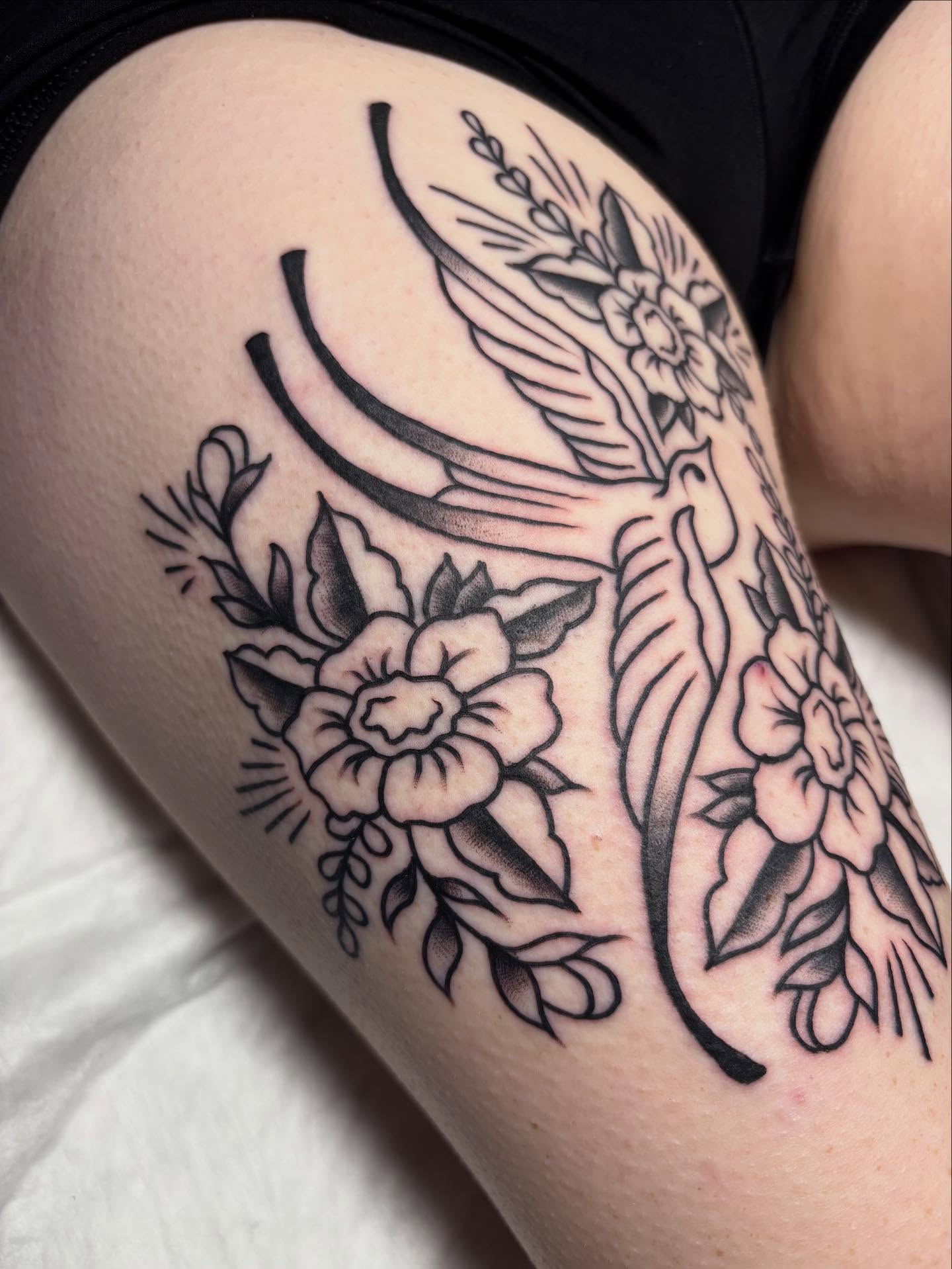 Bird and floral black and grey tattoo on the thigh by gia❤️‍🔥🎲, Maryville, Tennessee