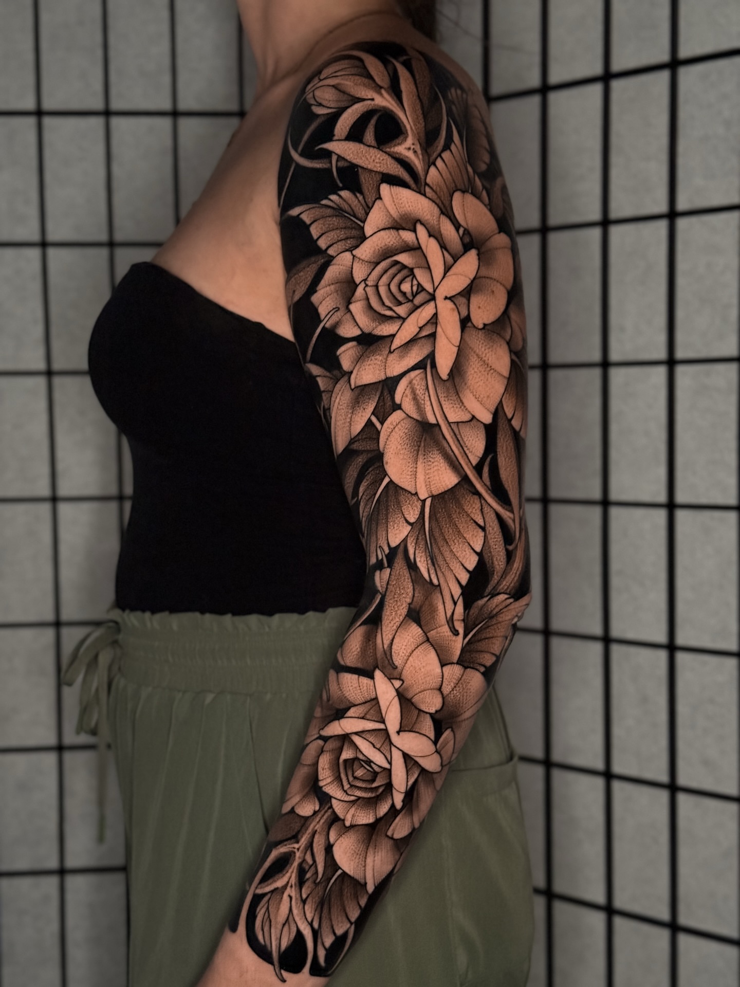Floral bouquet dotwork tattoo on the forearm by San Diego