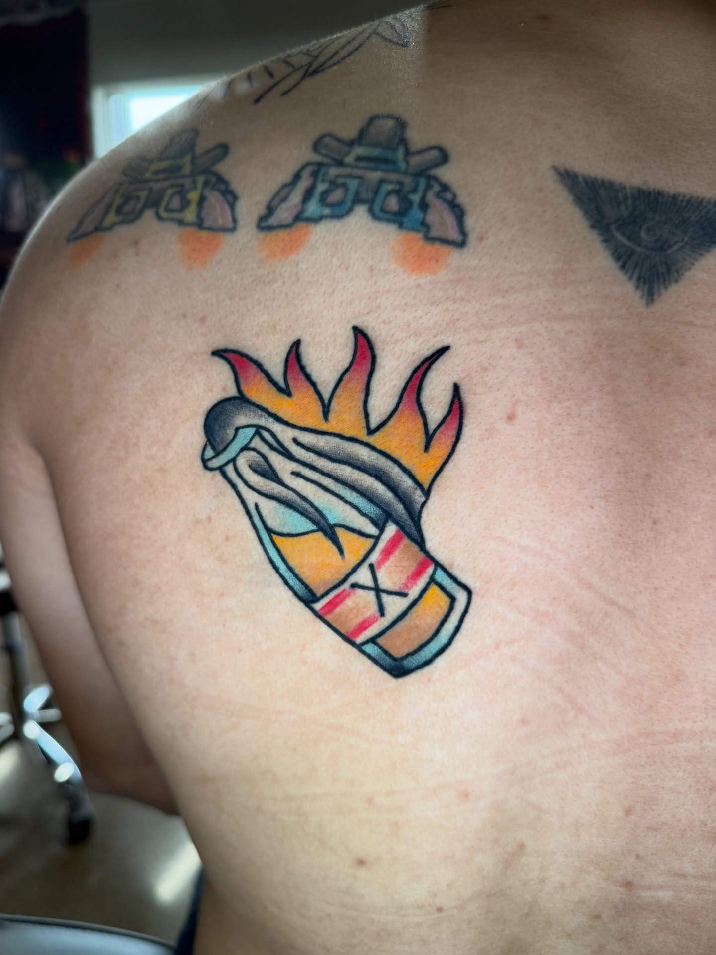 Flaming lighter neo-traditional tattoo on the shoulder by @ryanpereztattoo