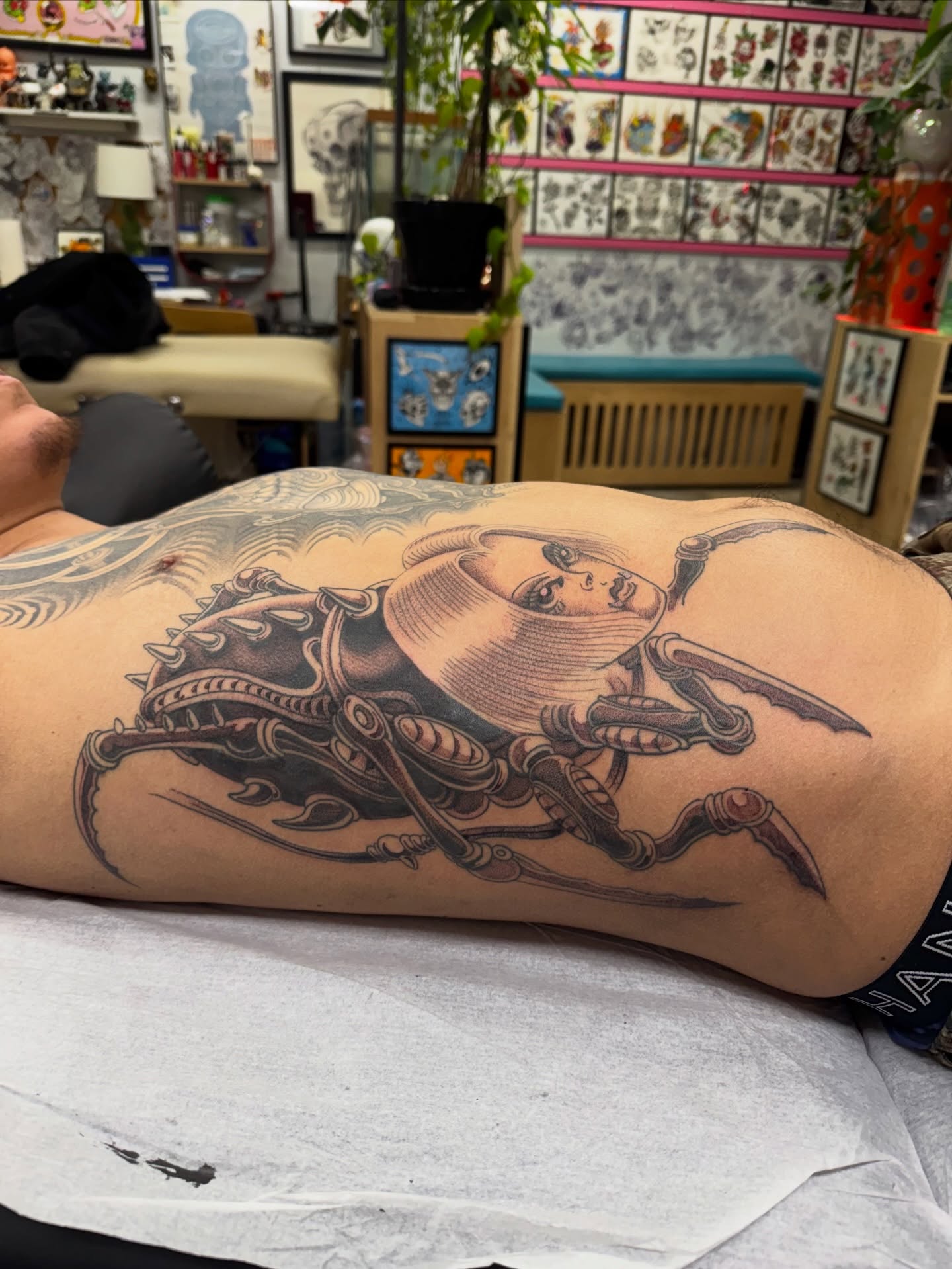 Cyborg woman realism tattoo on the back by Chris Orta