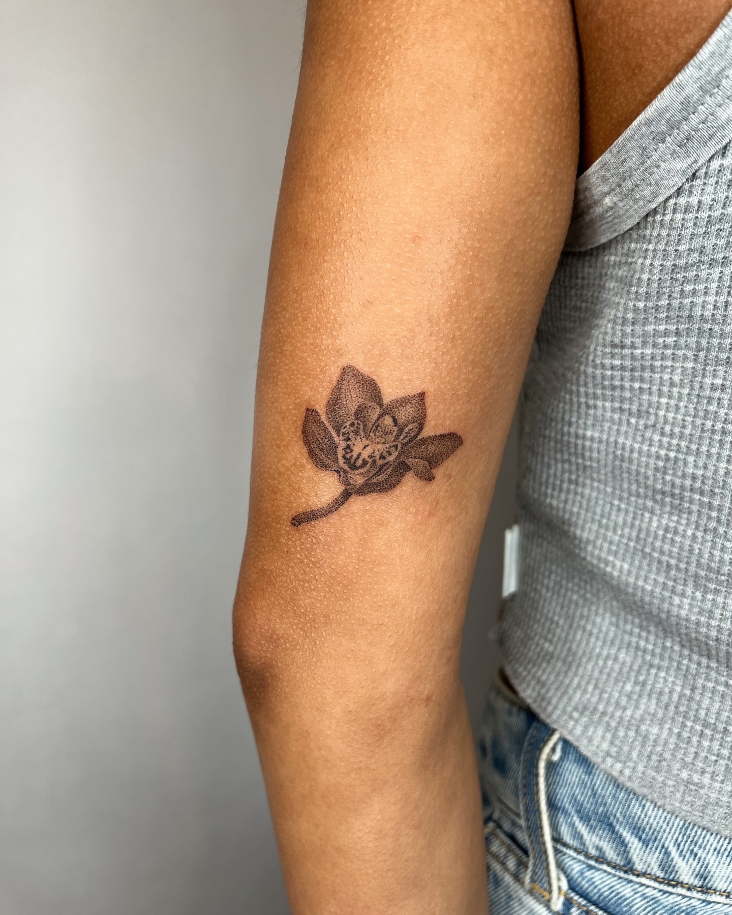 Lotus flower black and grey tattoo on the forearm by kait ❃ hartman