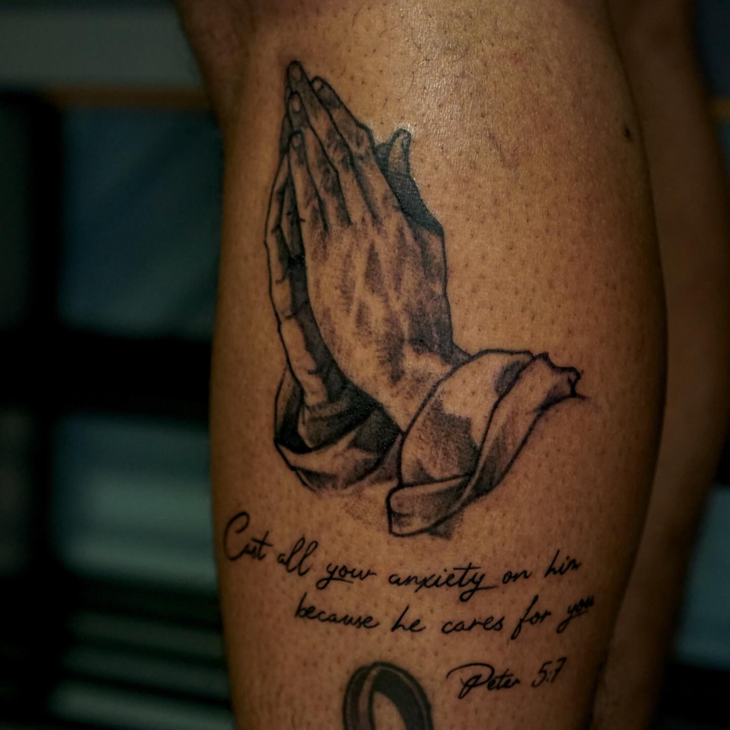 Praying hands black and grey tattoo on the forearm by Nicholas Capellan, Winter Park, Florida