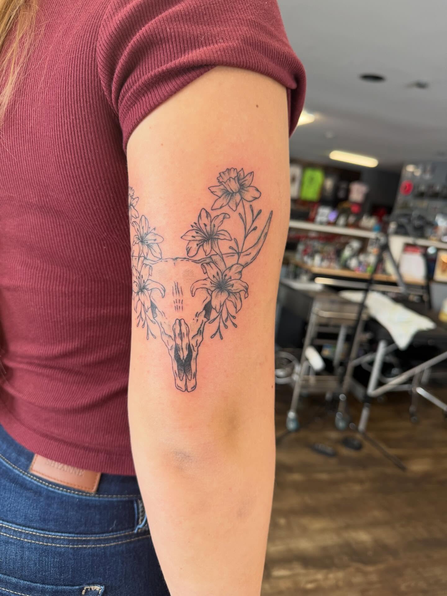 Deer skull with flowers black and grey tattoo on the forearm by Hope Powell, Vancouver, Washington