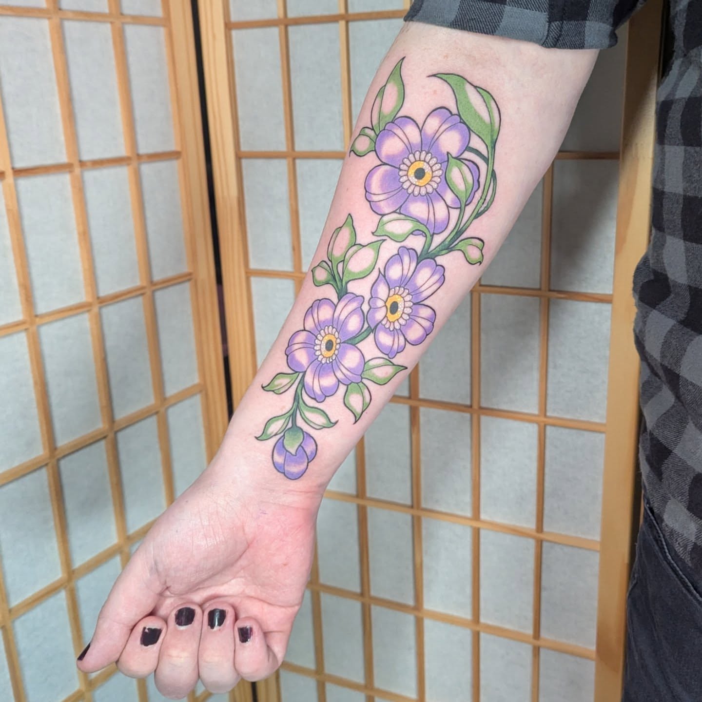 Purple flowers new school tattoo on the forearm by Nico Capriotti ๐ณ๏ธโ๐