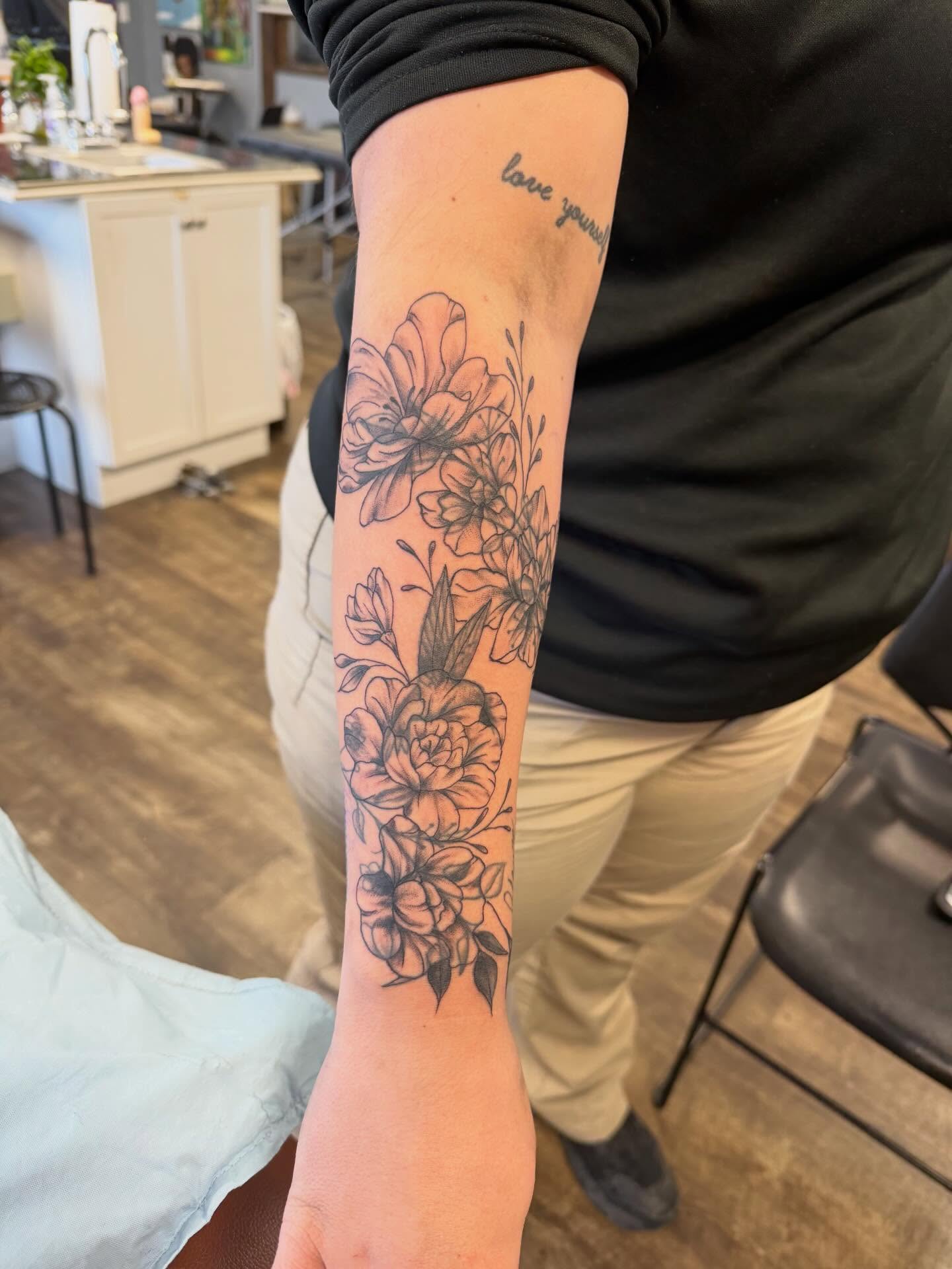 Floral bouquet black and grey tattoo on the forearm by Hope Powell, Vancouver, Washington