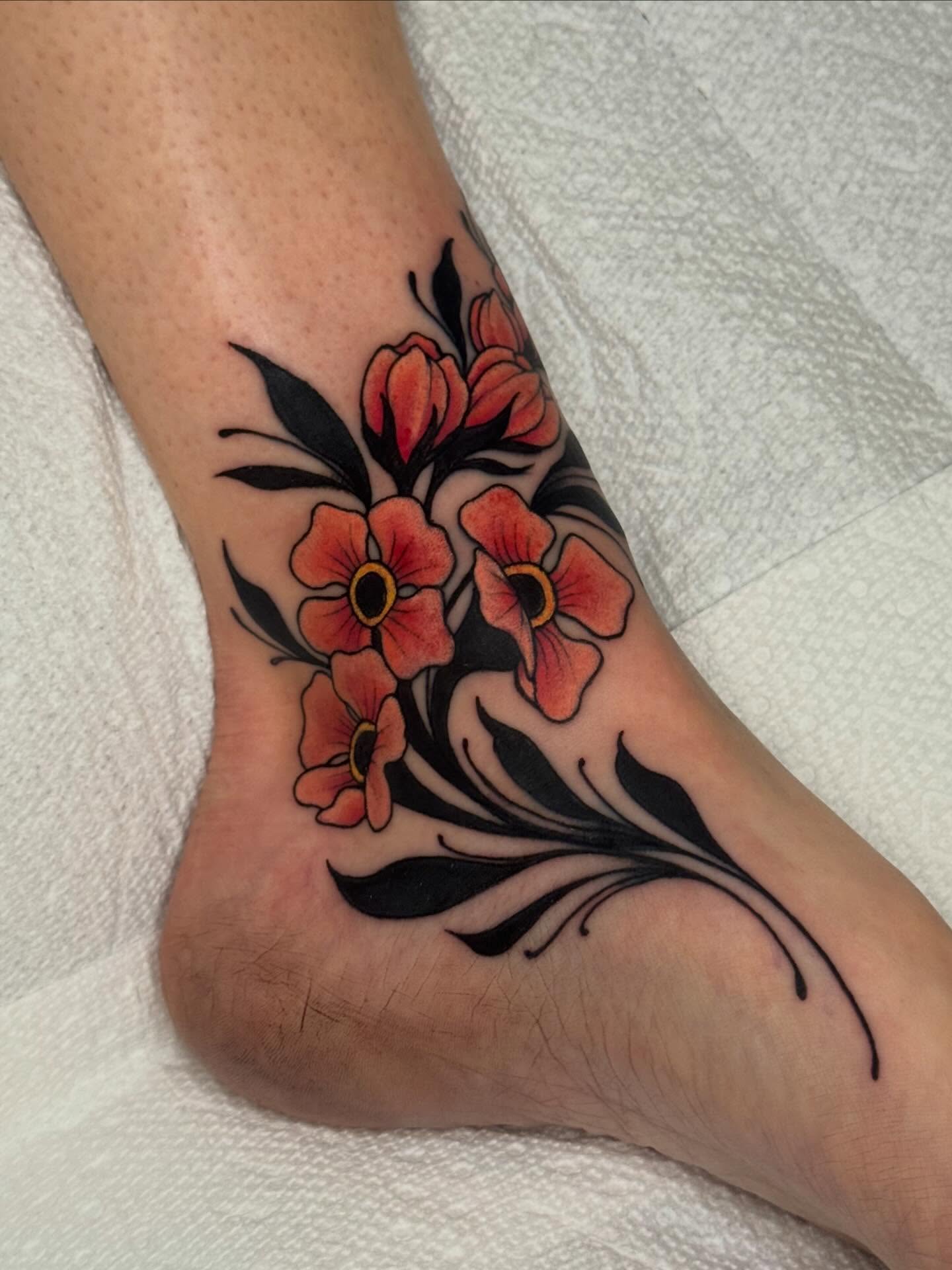 Floral bouquet American traditional tattoo on the foot by Painted Peach Tattooer