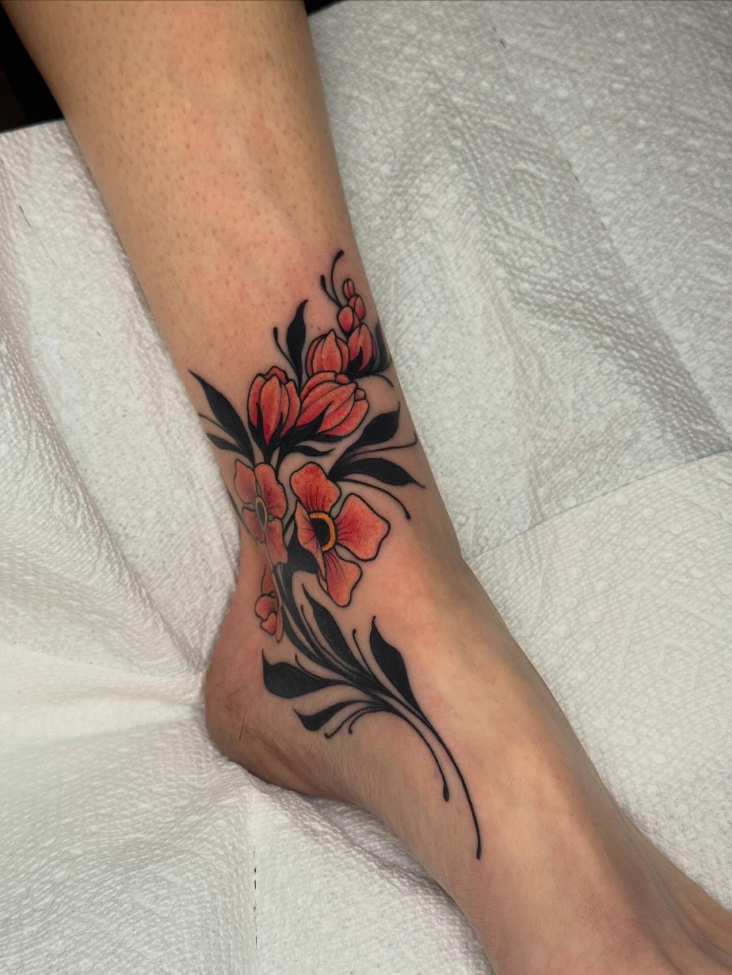 Floral arrangement new school tattoo on the foot by Painted Peach Tattooer