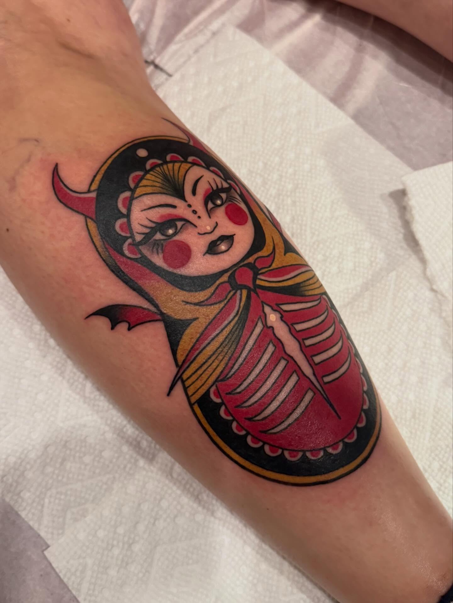 Matryoshka doll American traditional tattoo on the forearm by Paul Giovis