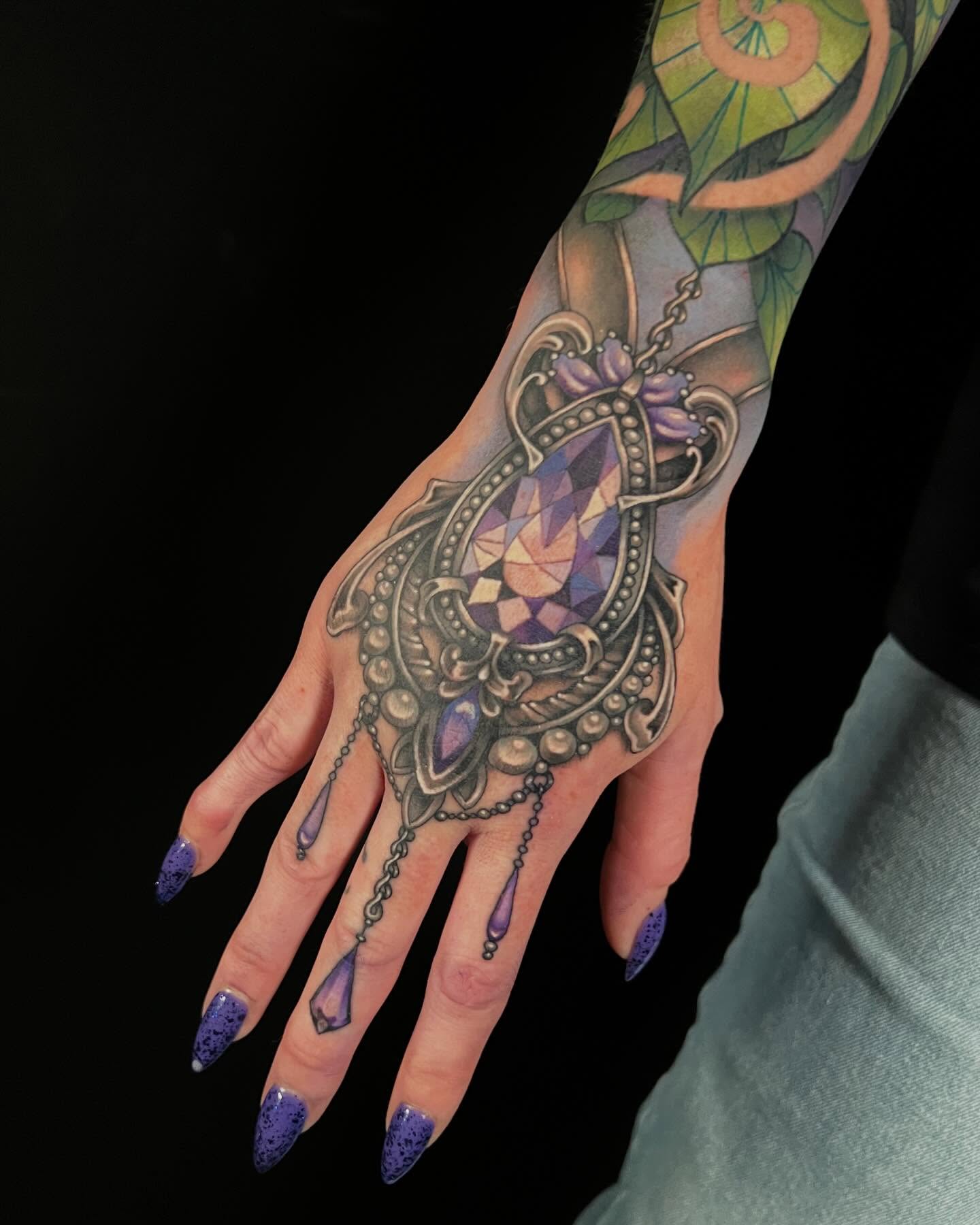 Jeweled pendant geometric tattoo on the hand by Jade Lewis
