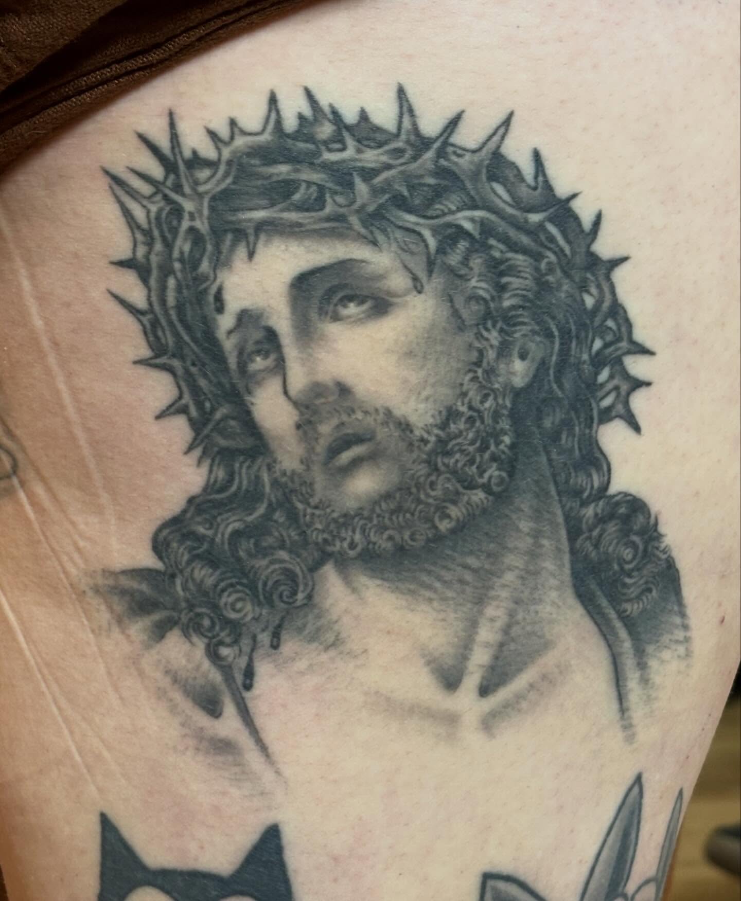 Jesus Christ realism tattoo on the shoulder by Steve Reid