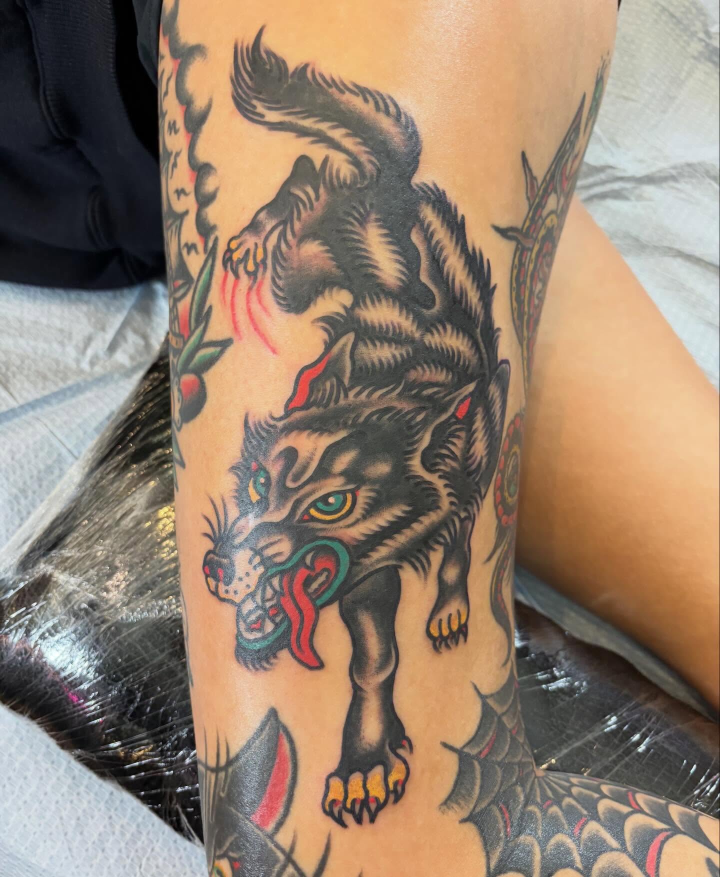 Wolf American traditional tattoo on the forearm by Steve Reid
