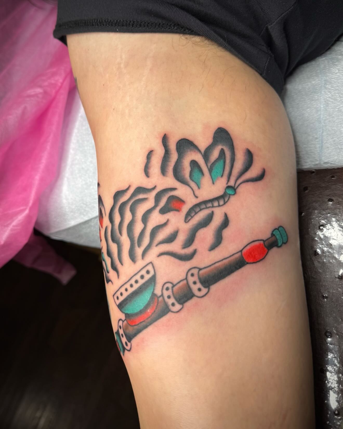 Brain and syringe American traditional tattoo on the thigh by kalli berry