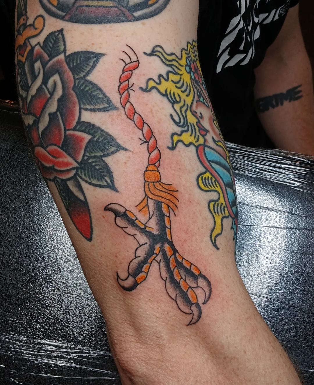 Rope and bird American traditional tattoo on the forearm by Amber Tattoos