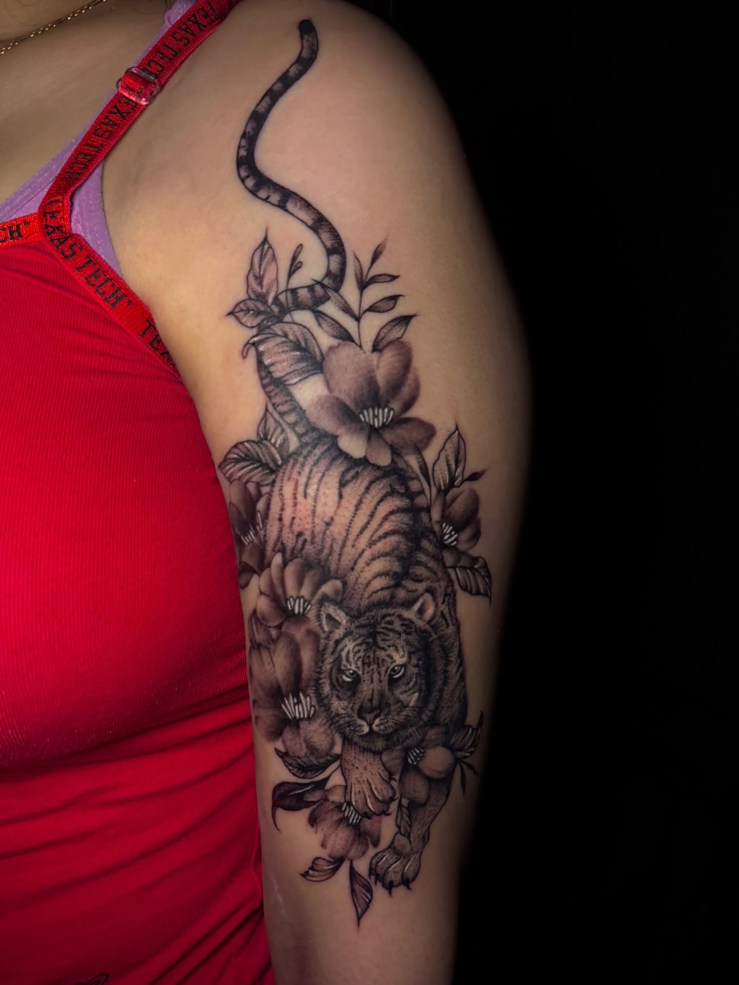 Tiger and snake realism tattoo on the shoulder by Tattoo Artist based in Dallas Tx