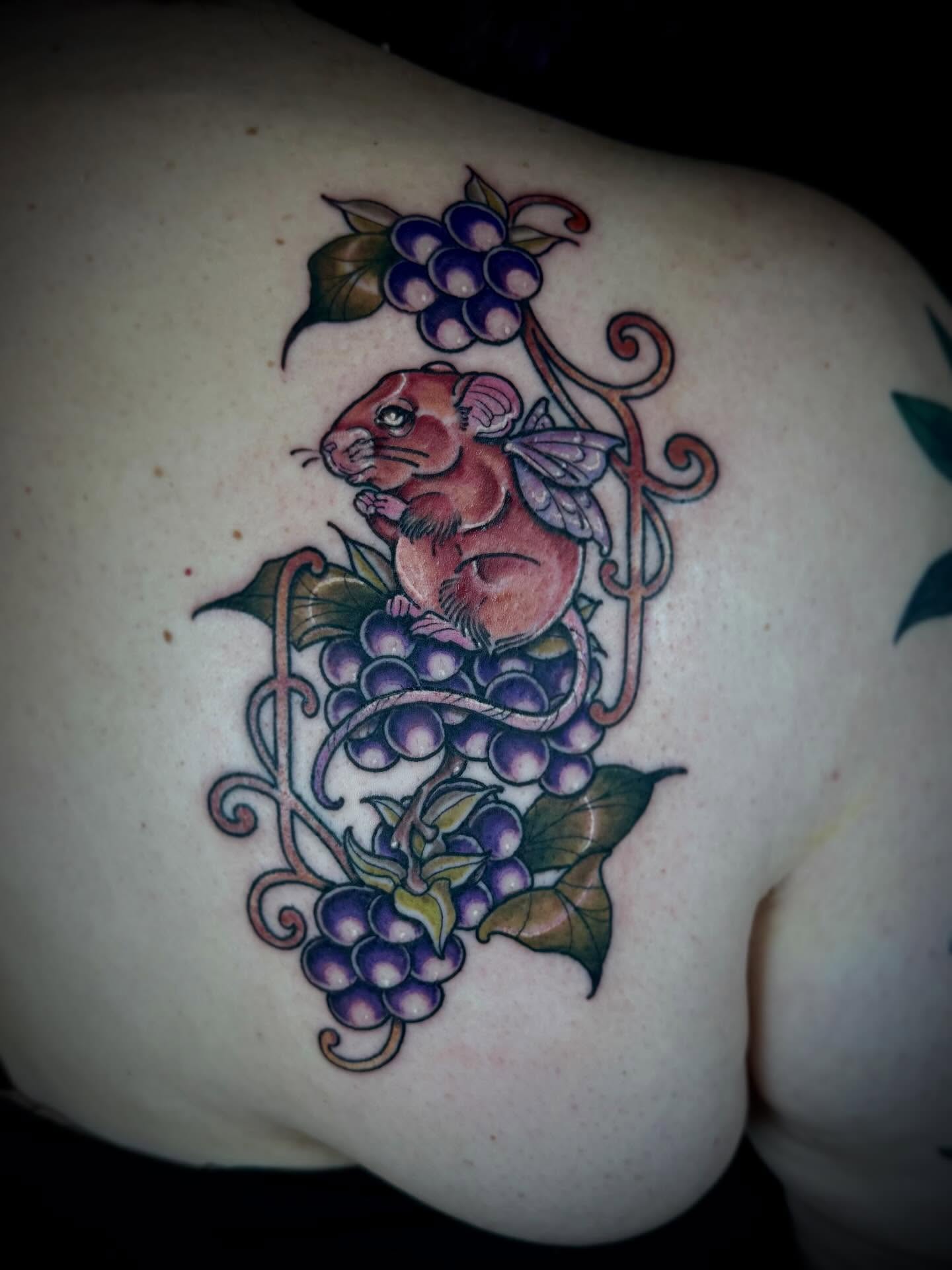 Mouse and grapes new school tattoo on the shoulder by 🏵