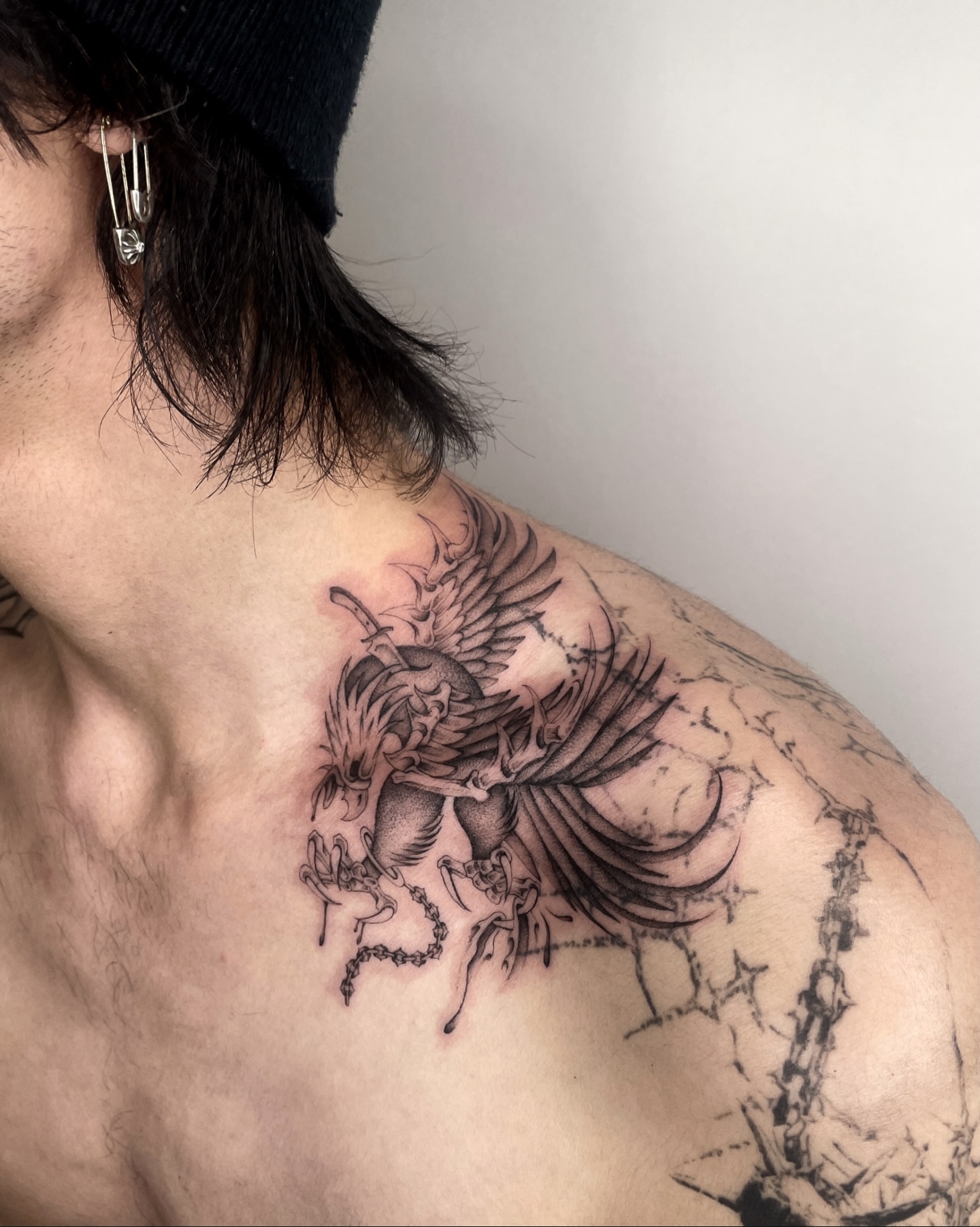 Phoenix black and grey tattoo on the shoulder by IVY