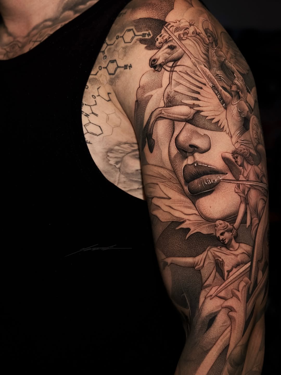 Mythological scene with face and horse surrealism tattoo on the upper arm by Ke$la