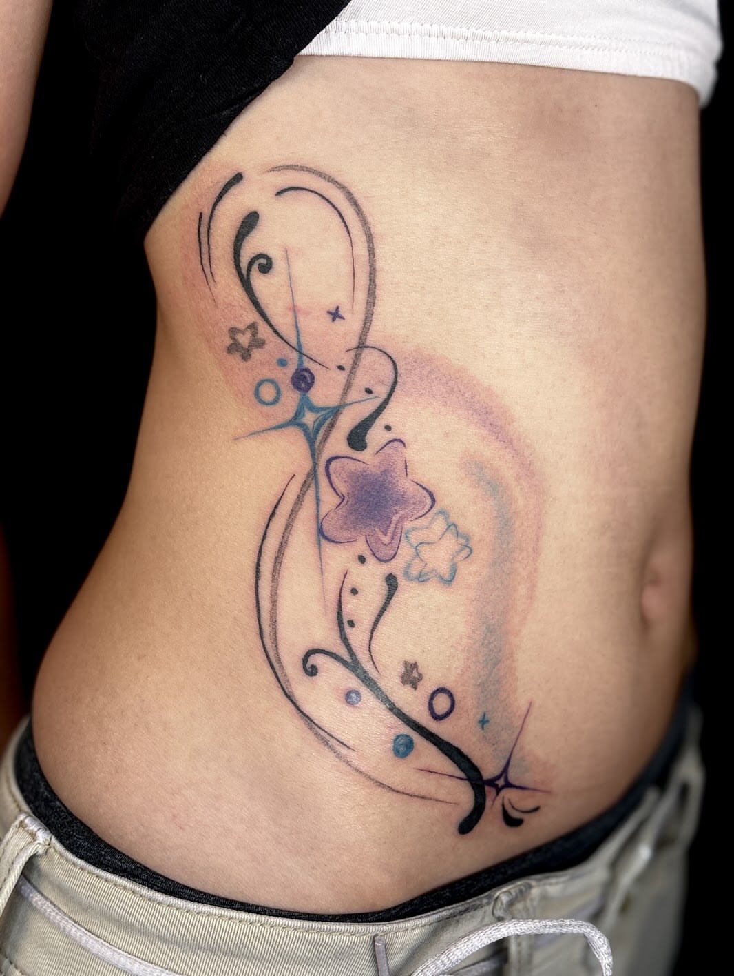 Abstract floral design dotwork tattoo on the ribs by *:・kelly✧*:・゚