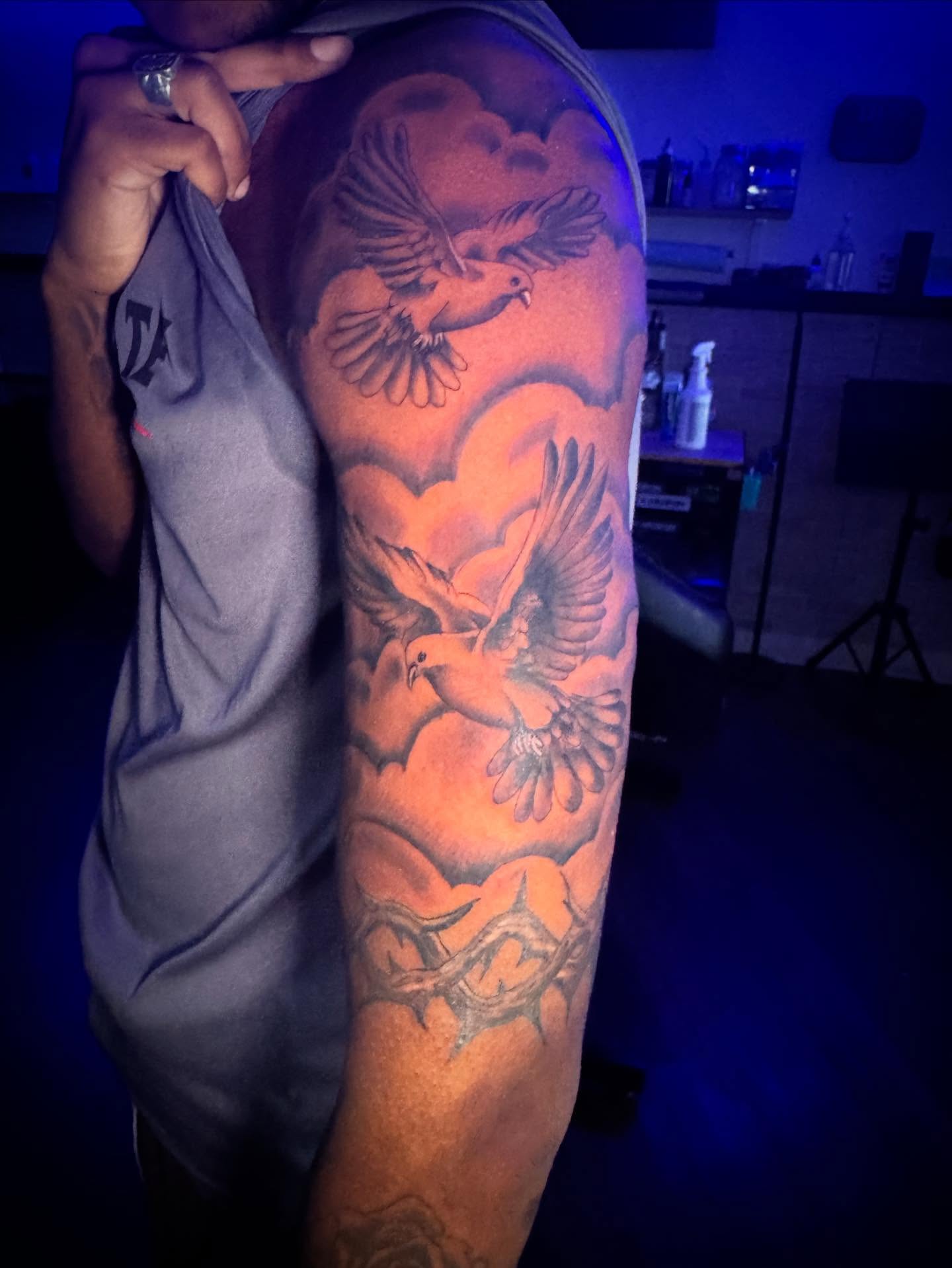 Birds and heart black and grey tattoo on the upper arm by LeLe