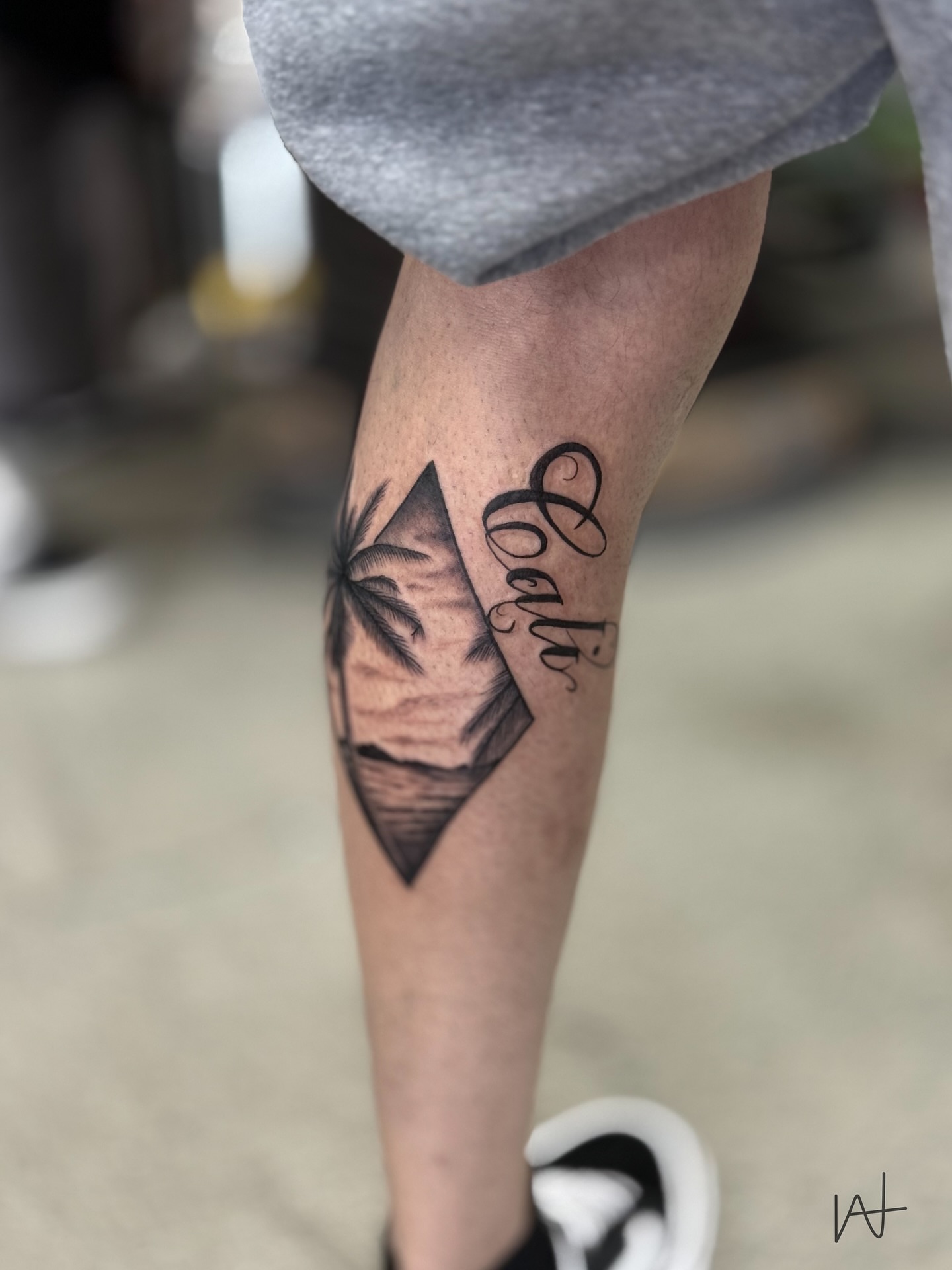 Beach scene geometric tattoo on the calf by Kat Parmu