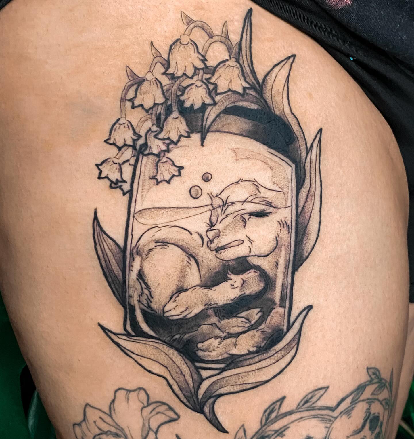 Lily of the valley and rabbit dotwork tattoo on the thigh by ✥ G i t t a ✥