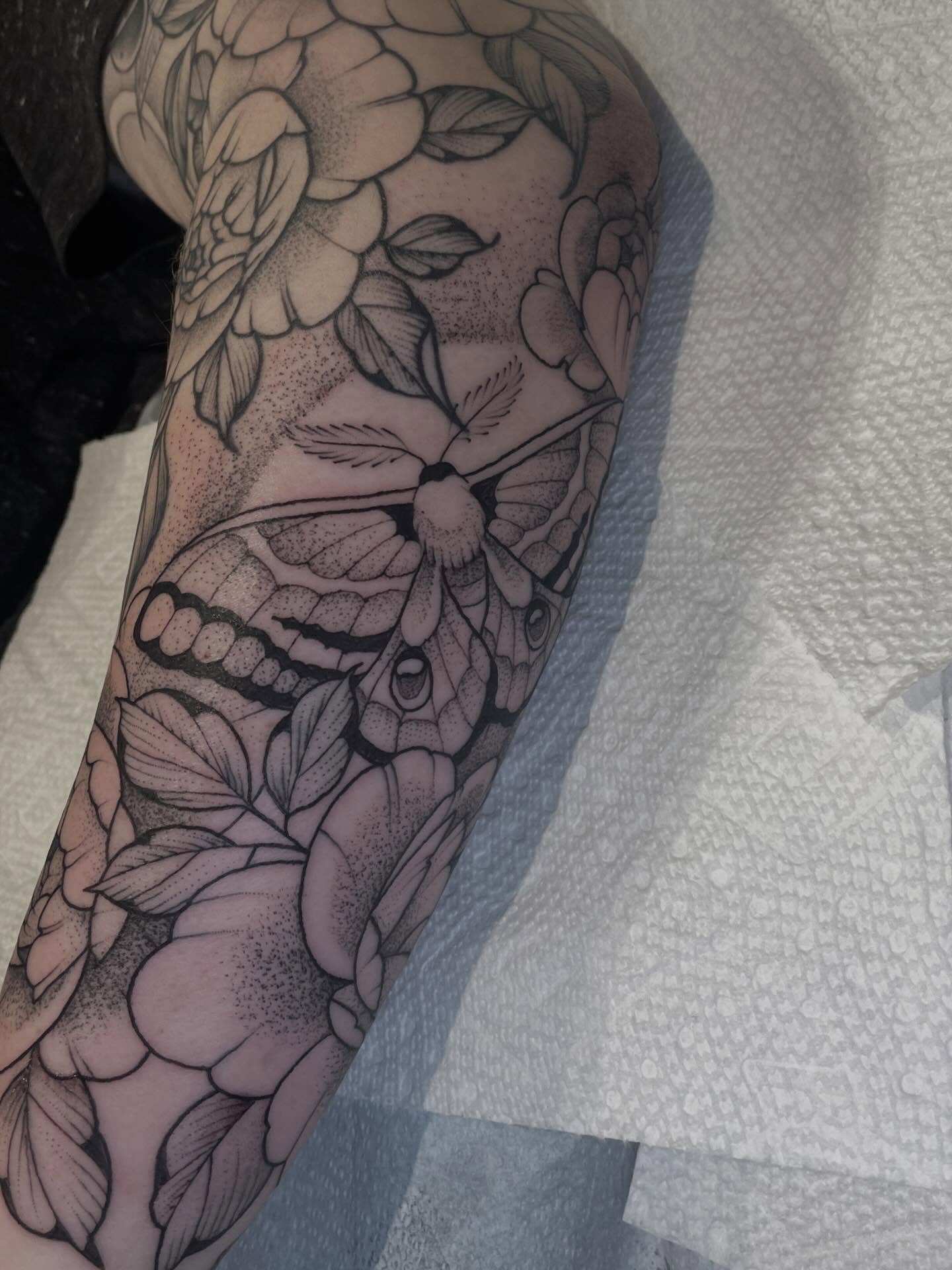 Butterfly and flowers dotwork tattoo on the forearm by Amanda Marie, Edmonds, Washington