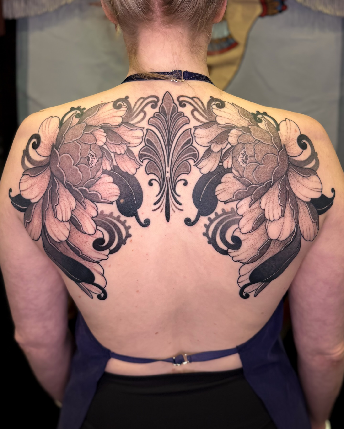 Floral ornamental tattoo on the back by Jena Perry