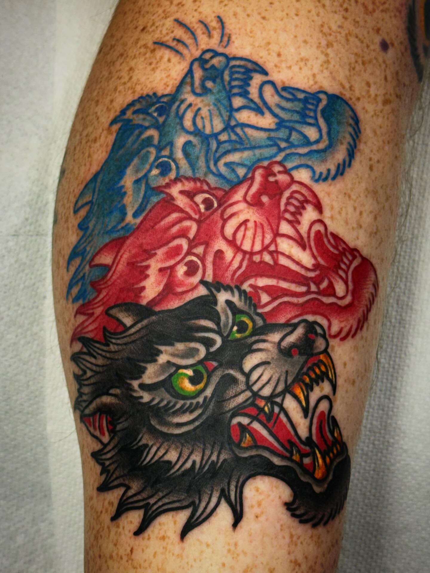 Wolf American traditional tattoo on the forearm by Mikey Sarratt