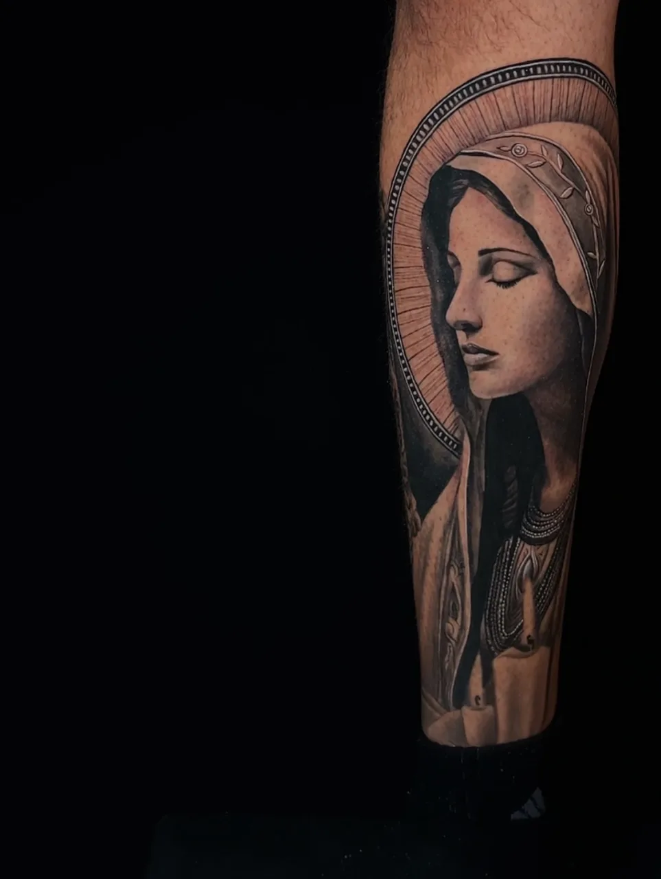 Religious figure realism tattoo on the forearm by Amilia Gullotta