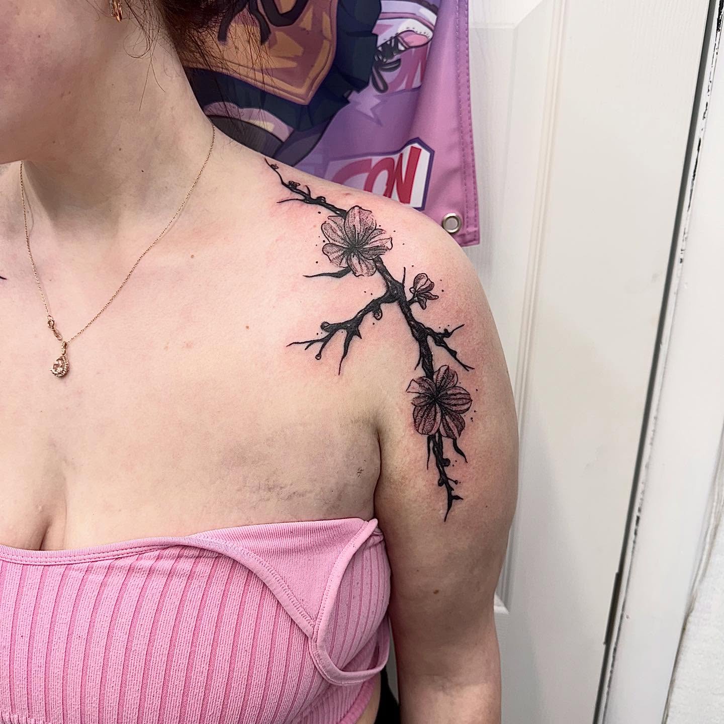 Cherry blossom branch dotwork tattoo on the shoulder by Abby Ash, Belington, West Virginia