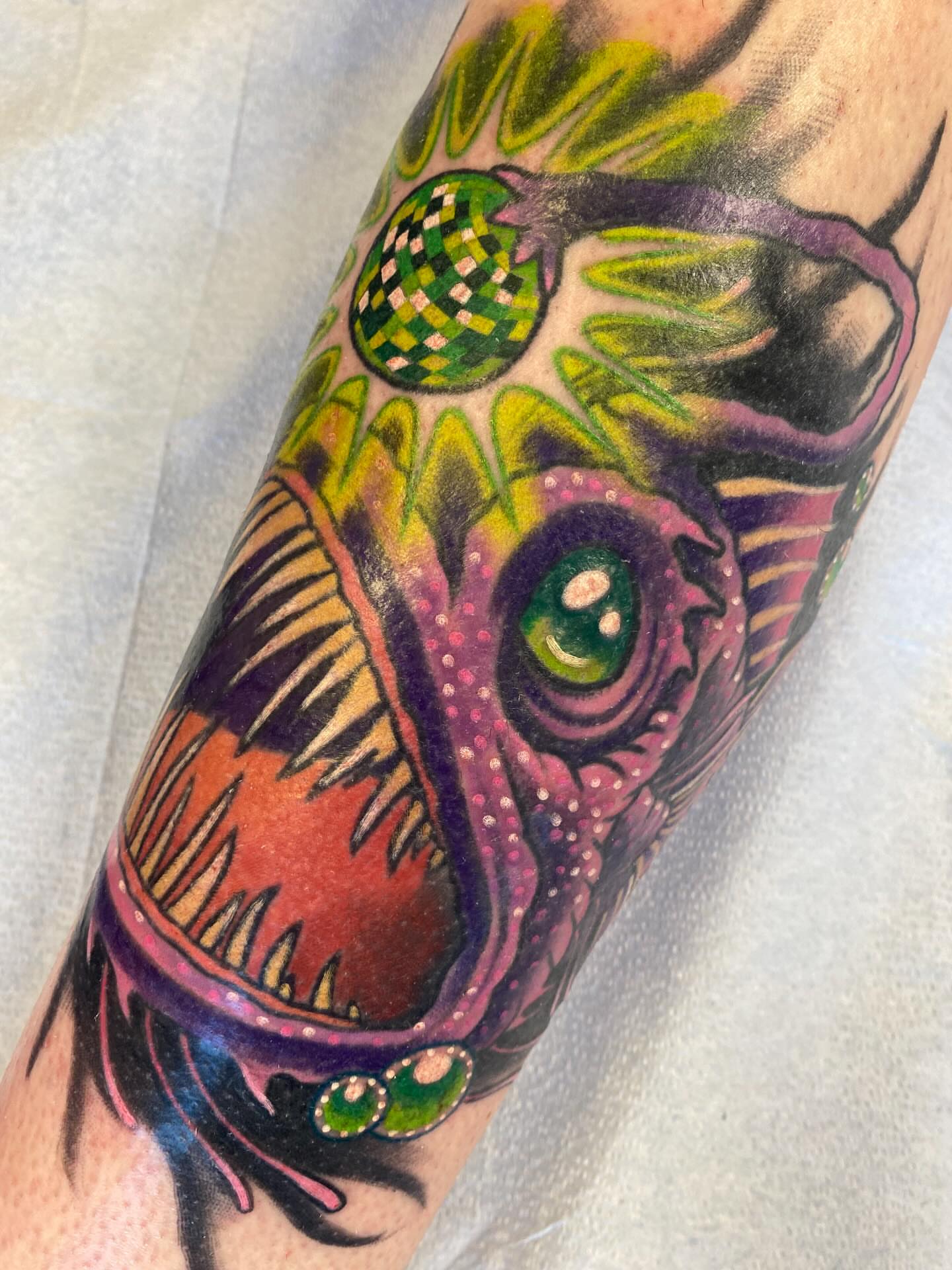Alien head dotwork tattoo on the forearm by Kellsey Mull