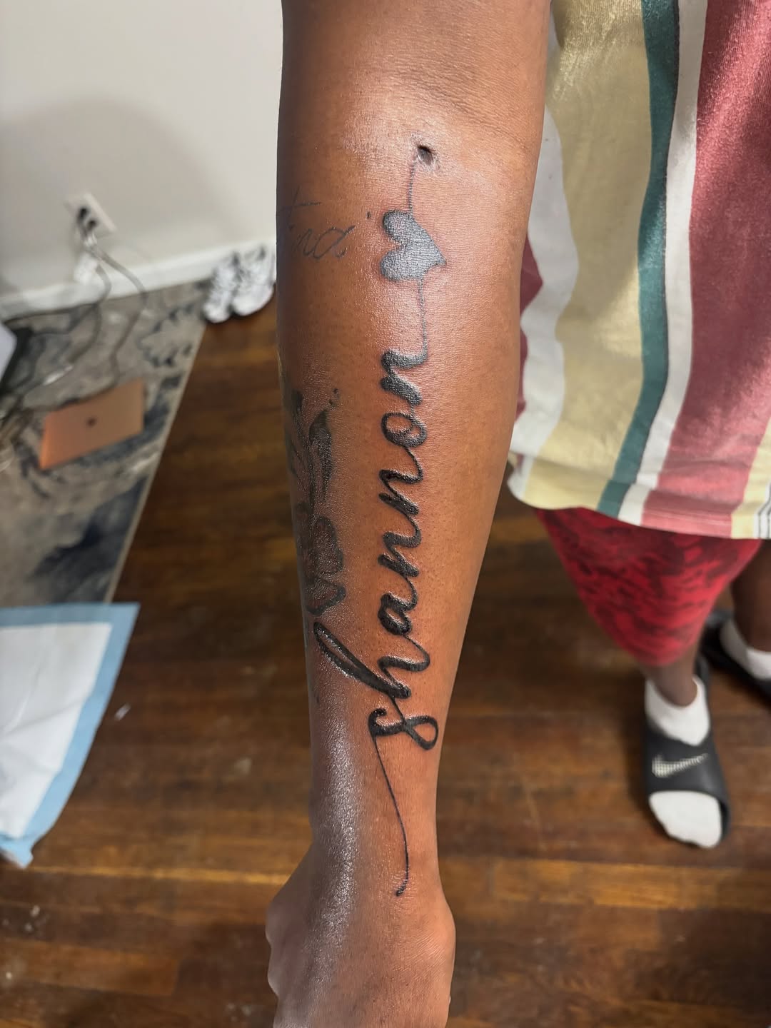 Shannon name tattoo with heart tattoo on the forearm by Danimals