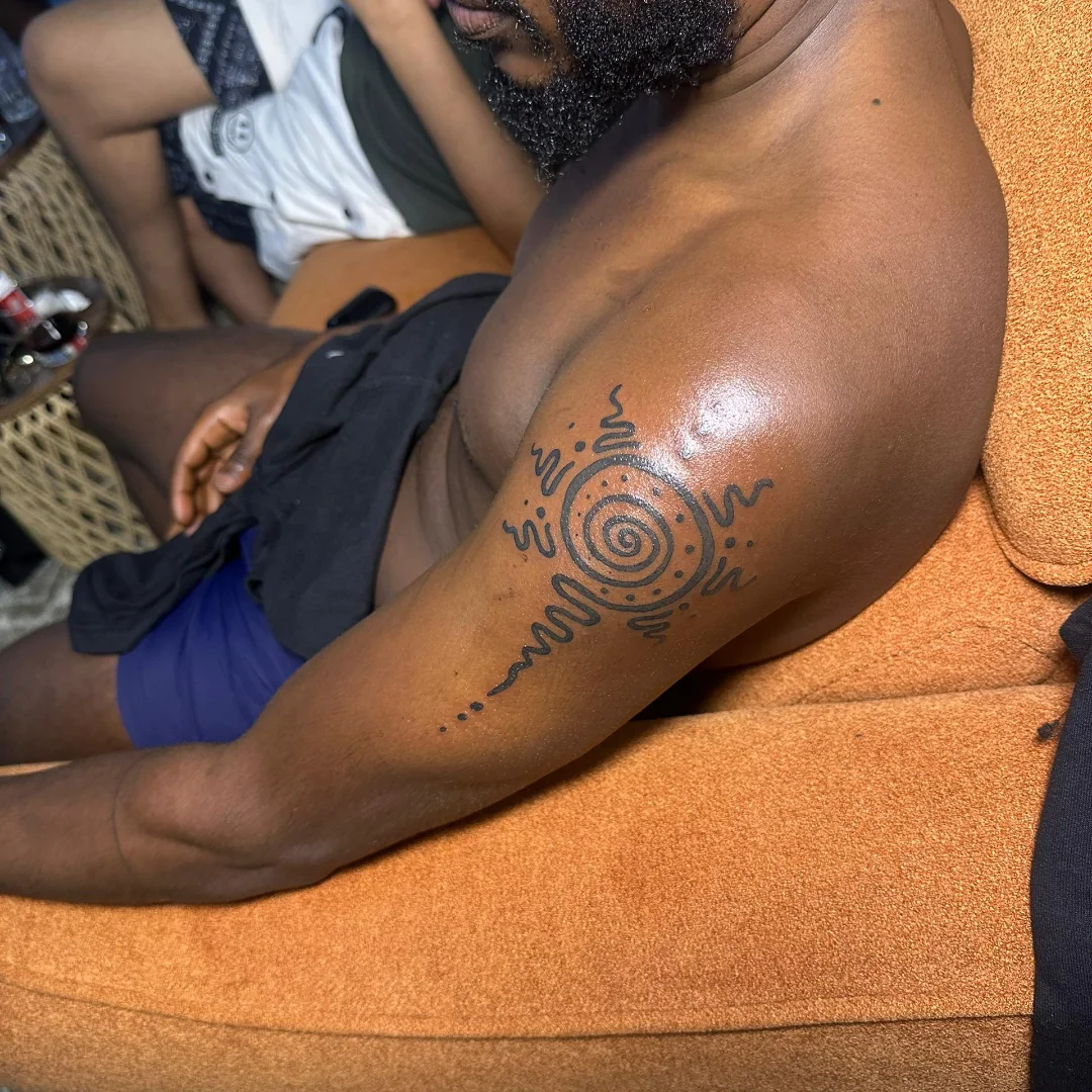 Sun dotwork tattoo on the upper arm by Mwangaza Bodyworks, Uthiru, Nairobi Area, Kenya