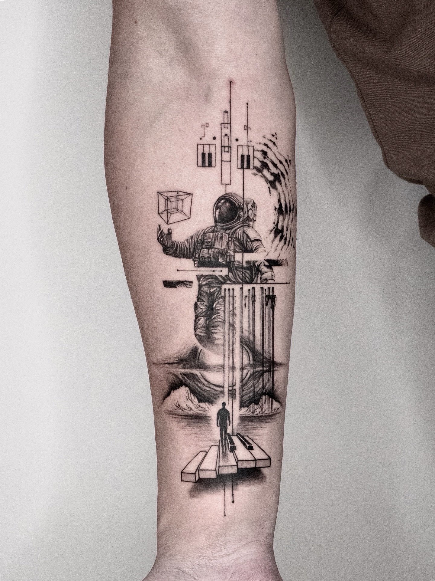 Astronaut realism tattoo on the forearm by János Bozóki, Budapest, Hungary