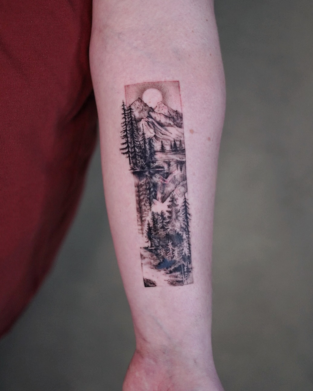 Mountain landscape realism tattoo on the forearm by Lily, Los Angeles, California
