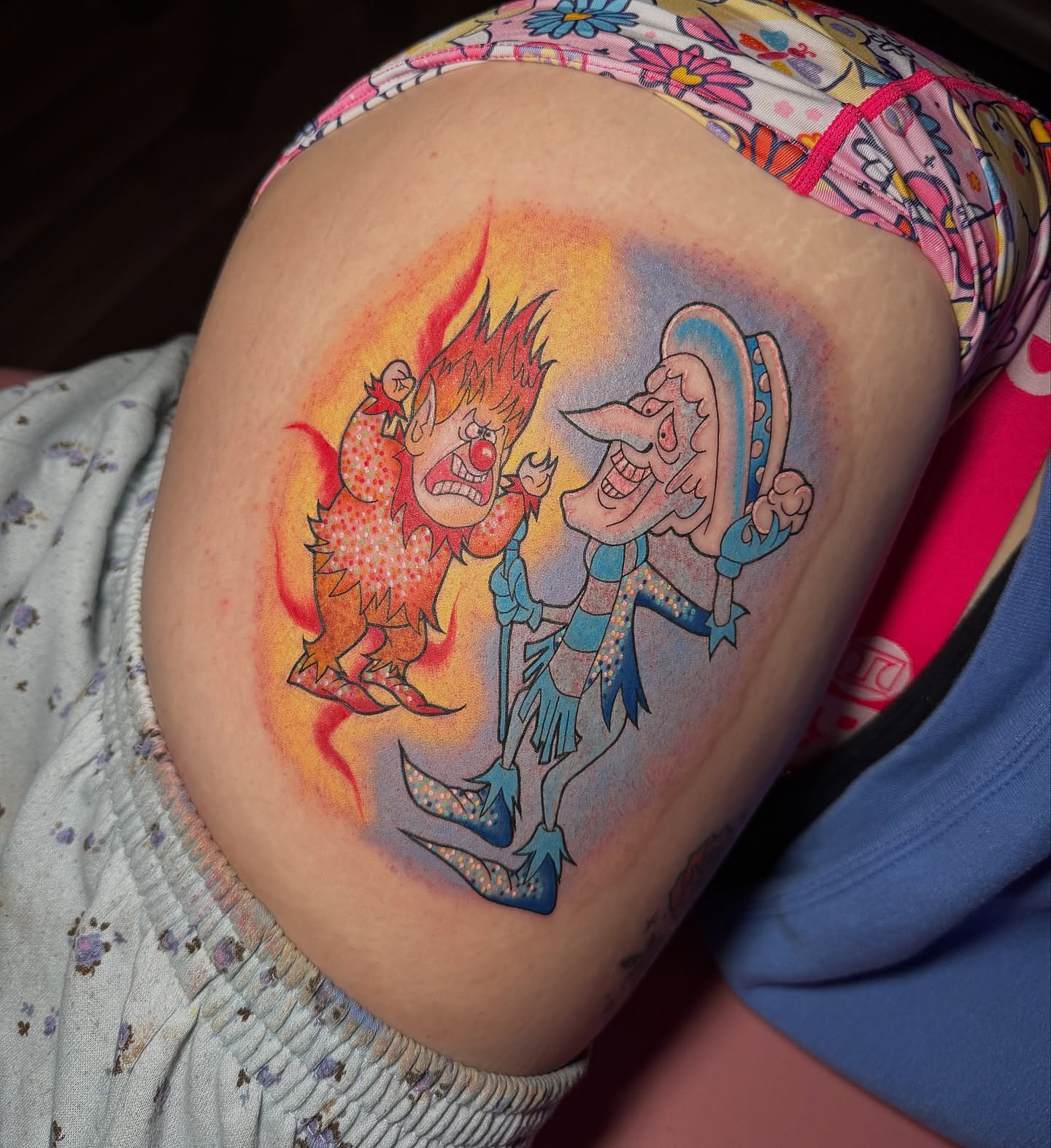 Flame and clown dotwork tattoo on the thigh by Lyndze Masters