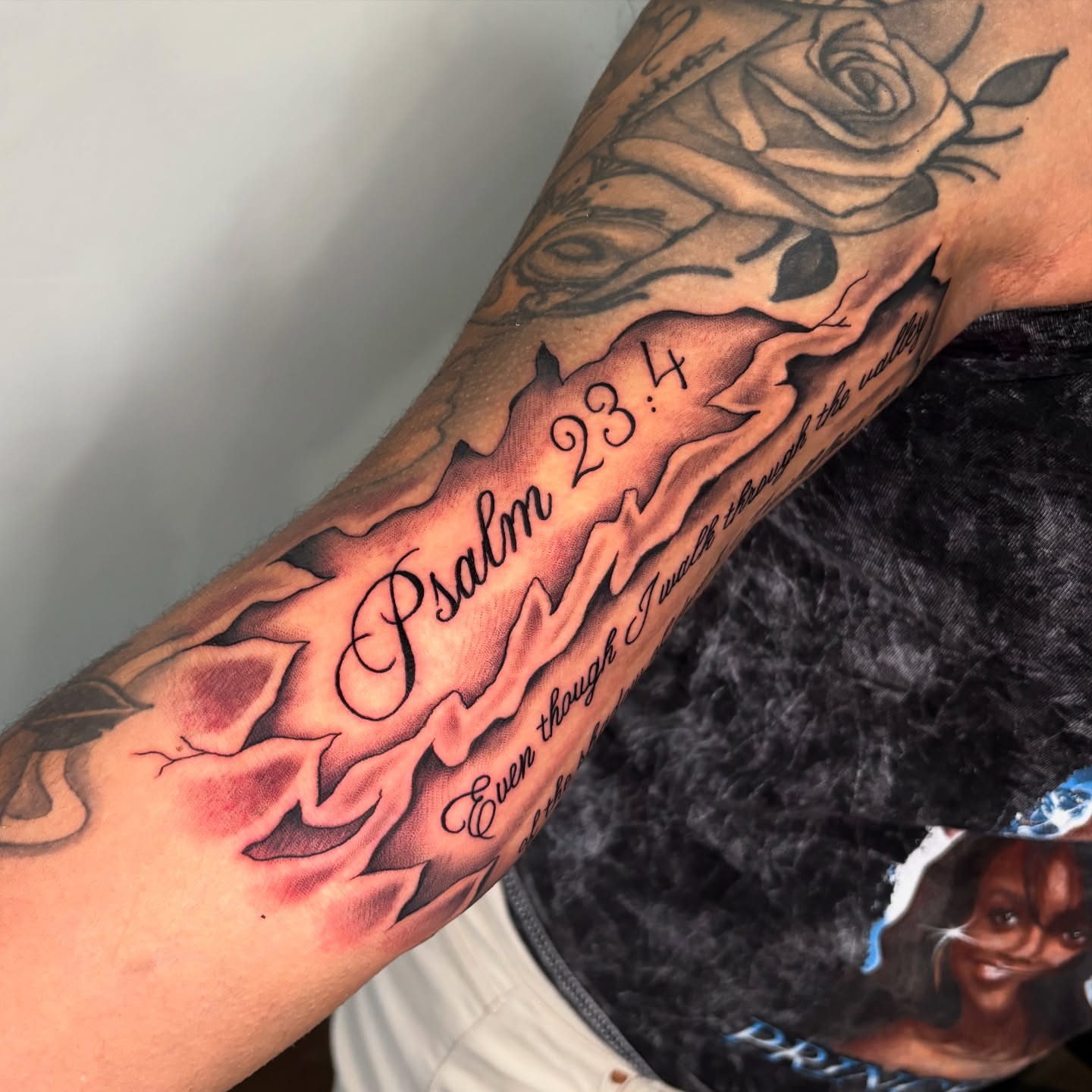 Psalm 23:4 black and grey tattoo on the forearm by Osiel Rodriguez