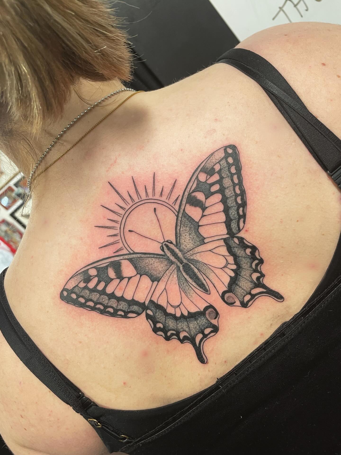 Butterfly and sun realism tattoo on the back by Andres Patino 🇪🇨🇺🇸