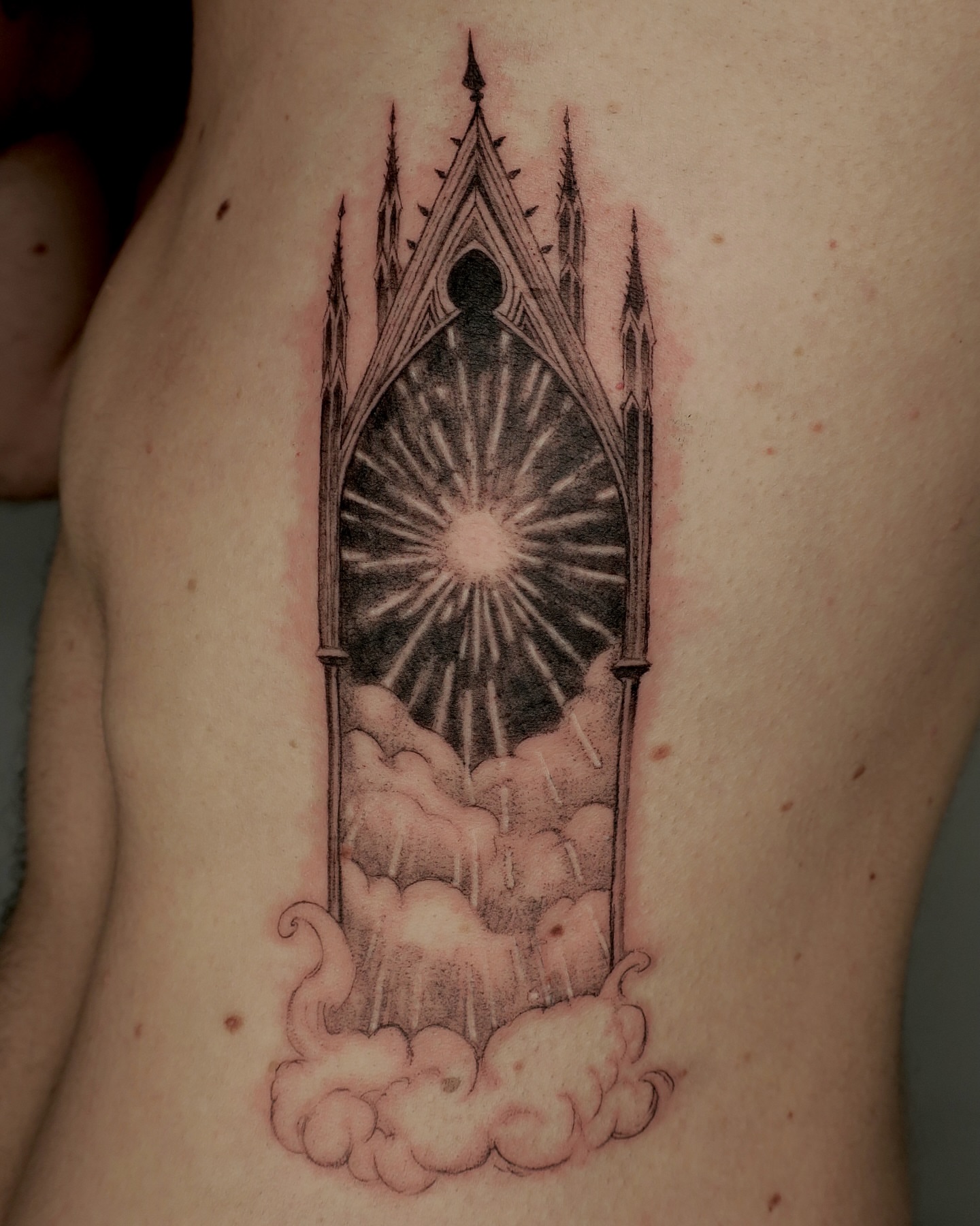 Gothic window black and grey tattoo on the ribs by Olivia