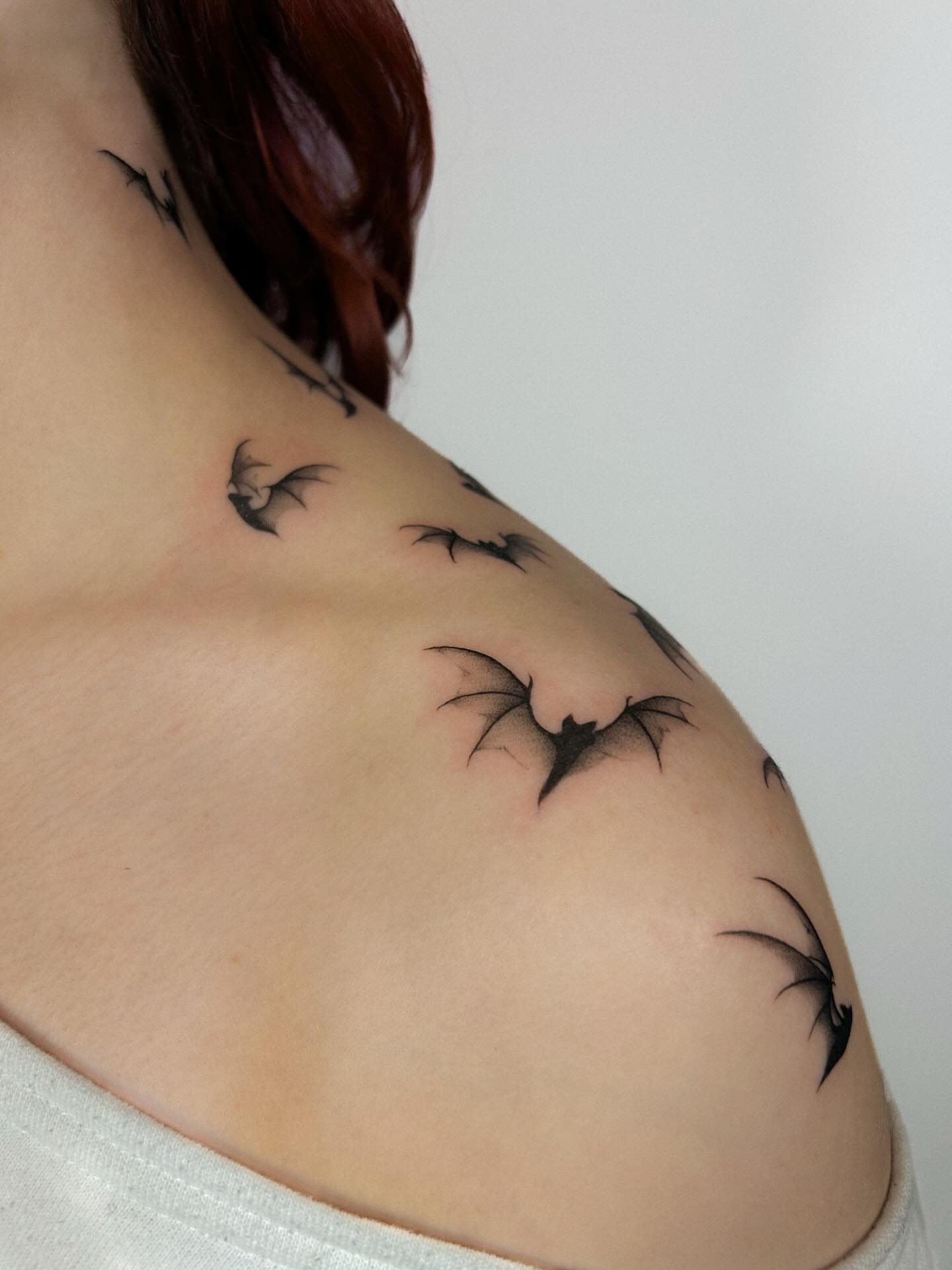 Bat black and grey tattoo on the shoulder by Chloe