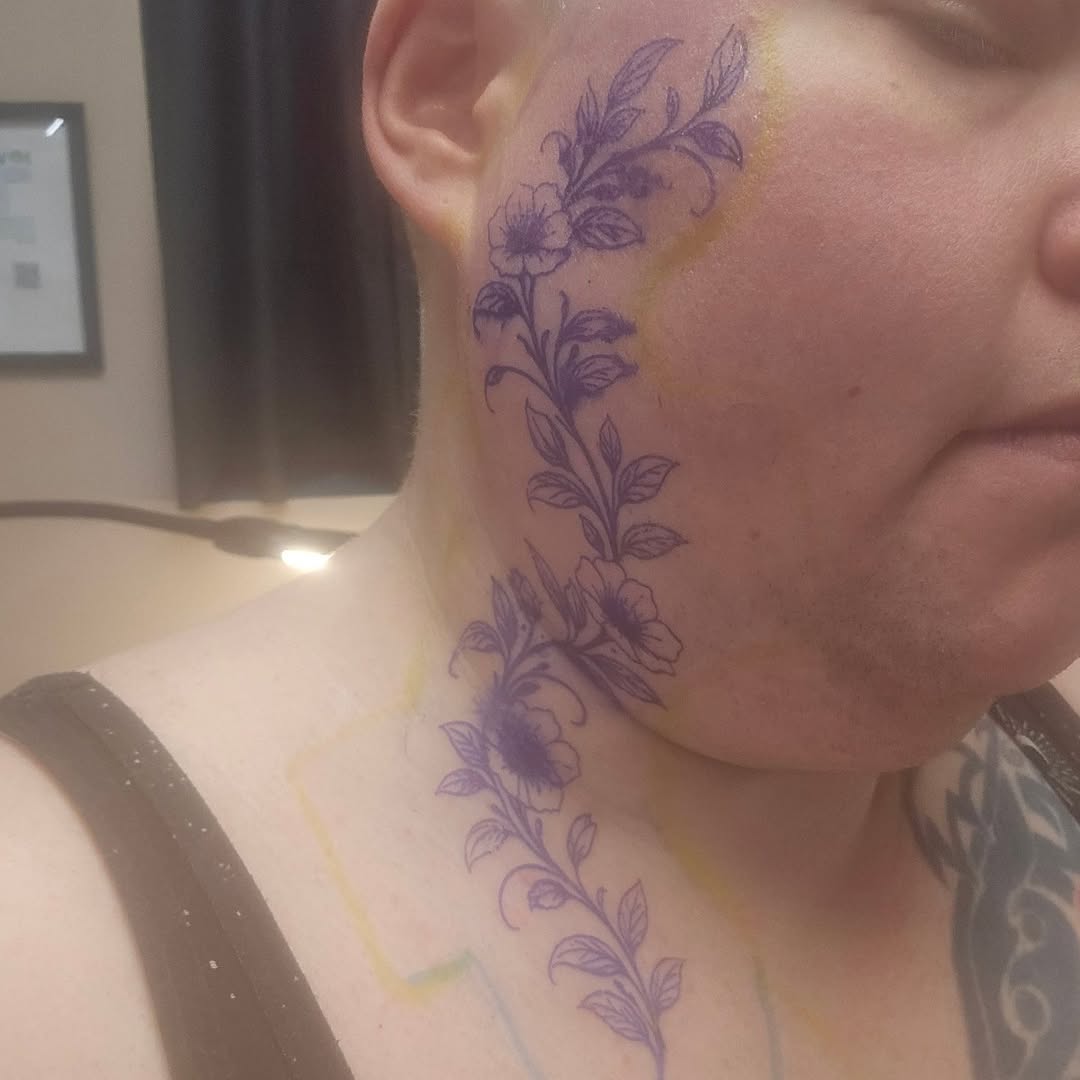 Floral vine tattoo on the neck by Catherine B