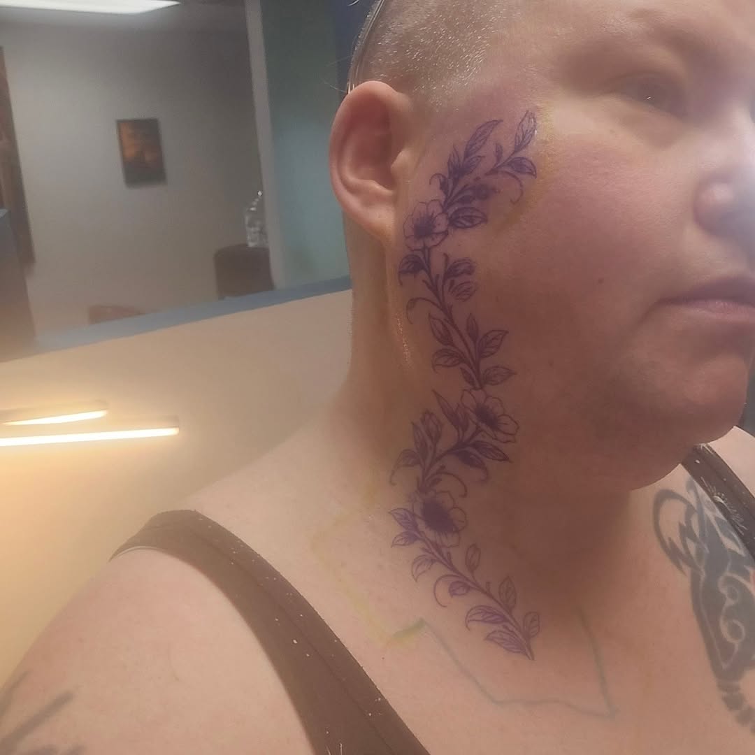 Floral vine tattoo on the neck by Catherine B
